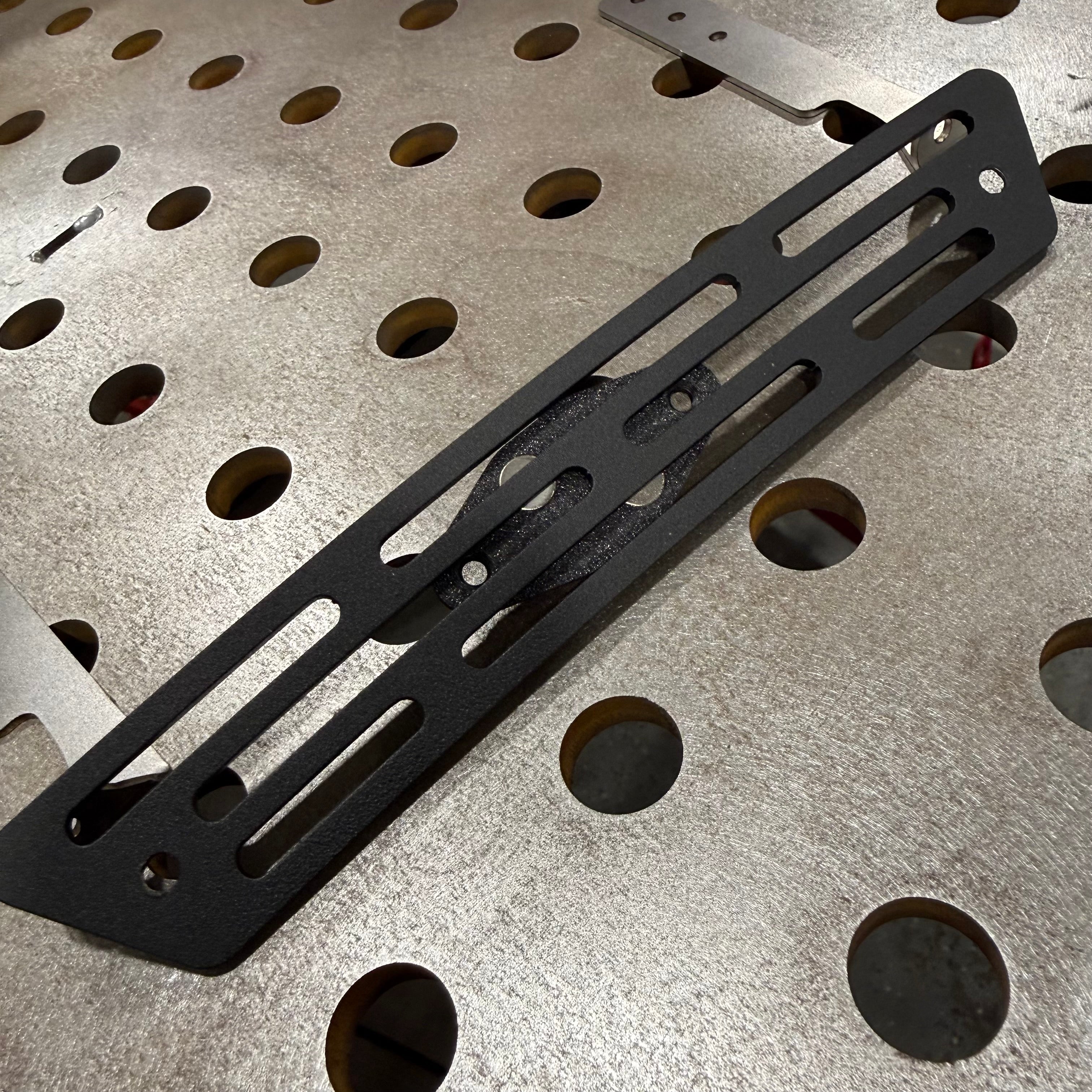 Elevate Metalcraft AMP Ball Magnetic Nut Plates with diamond shape and two bolt holes for secure fastening and easy installation.