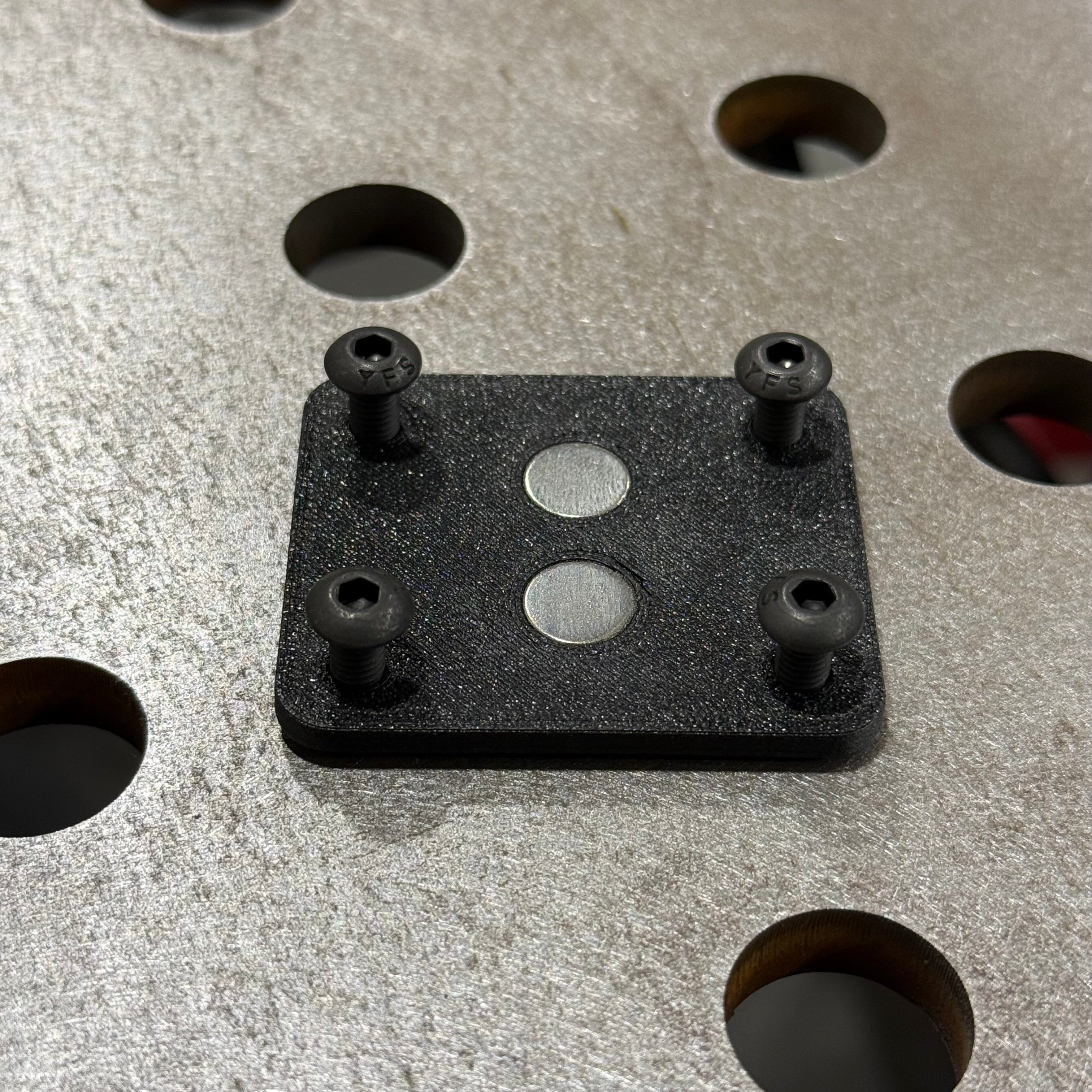 Elevate Metalcraft AMP Ball Magnetic Nut Plates with two bolts, featuring diamond-shaped design for secure fastening.
