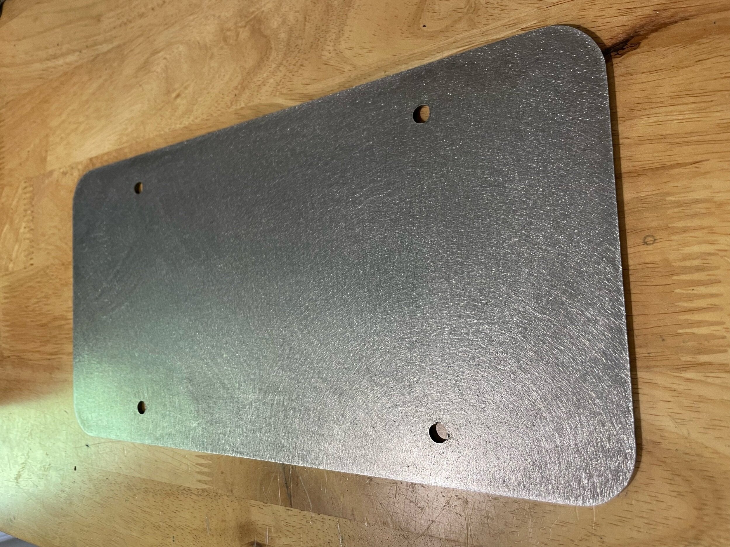 Elevate Metalcraft bolt-on license plate mount for trailers, flatbeds, RVs, and campers made of heavy-duty steel.
