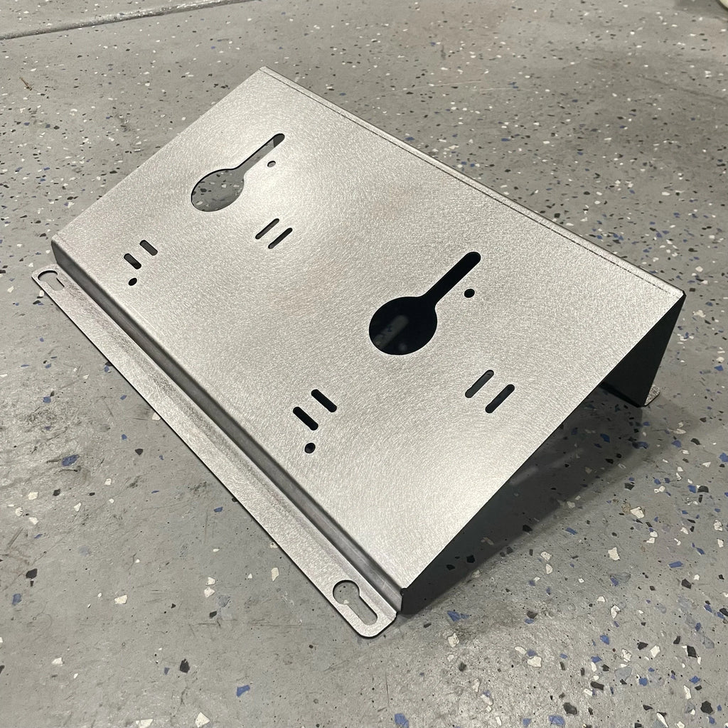 Elevate Metalcraft wall mount plate for Milwaukee M18 M12 rapid battery charger, 20-degree angle for van, truck, or workshop installation.