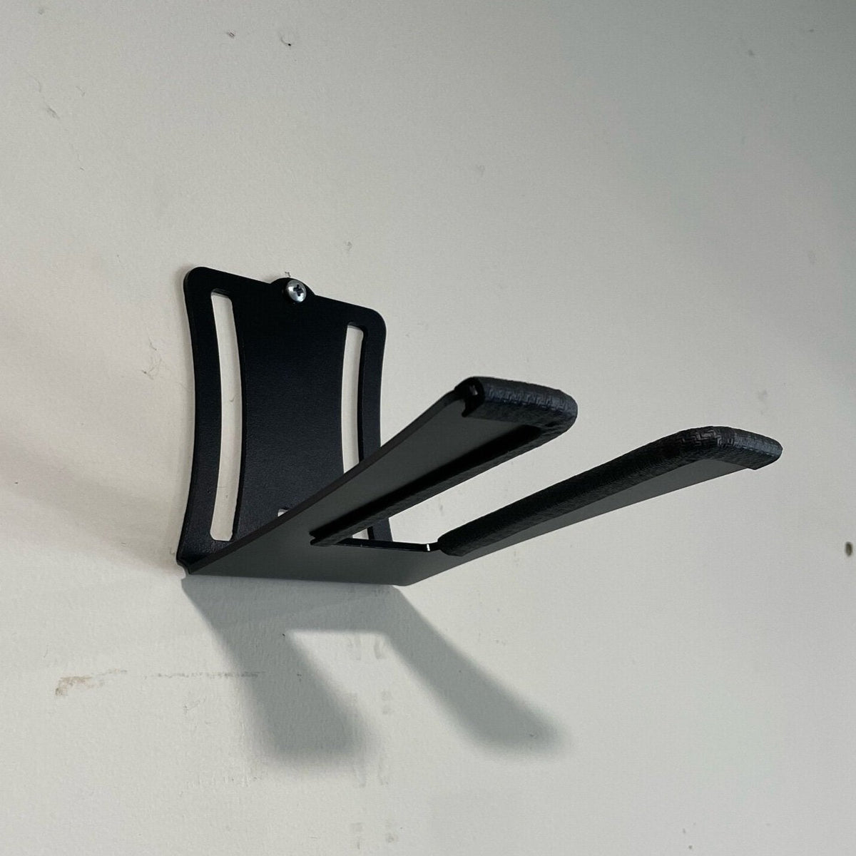 Raw metal wall mount for Park Tool bicycle repair stands, compatible with PRS-25, PRS-26, PRS-5, PCS-1, and PCS-10, for storage.