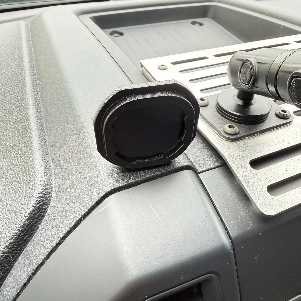 Black Elevate Metalcraft Quad Lock adapter attached to a PopSocket for secure phone mounting and compatibility.