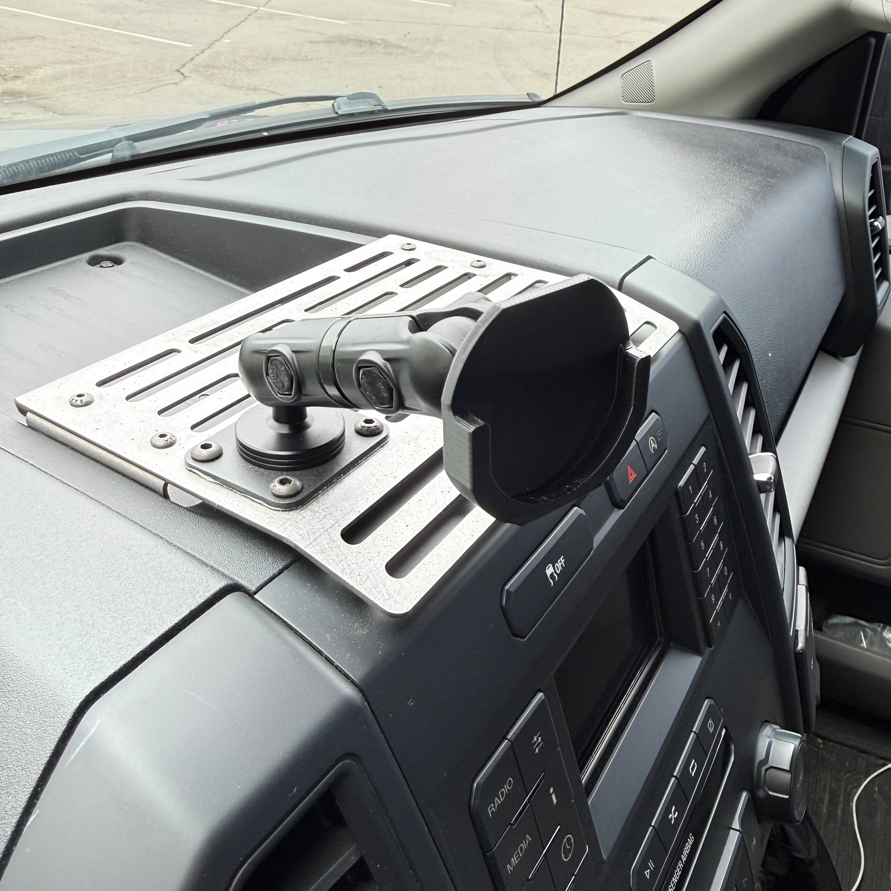 Black Elevate Metalcraft Quad Lock adapter attached to a PopSocket for secure device mounting.