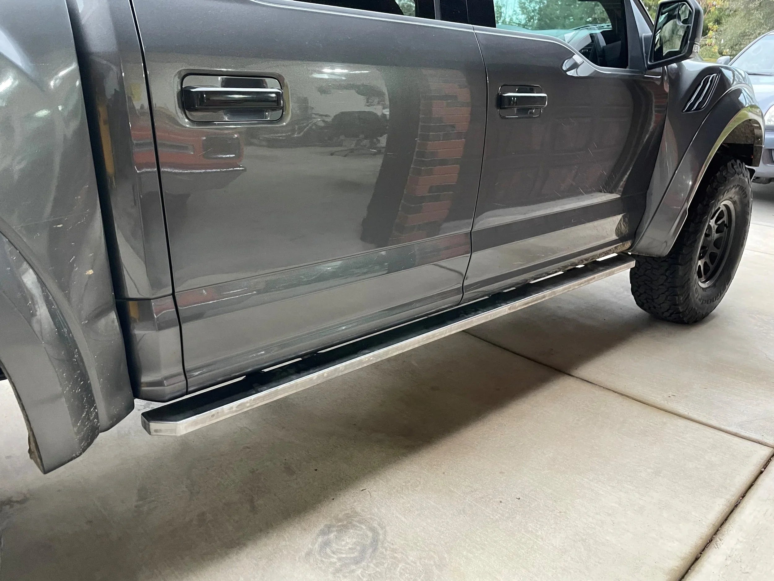 Elevate Metalcraft Rock Slider Steps for Ford F-150 Raptor SuperCrew 2015-2020, durable side protection for 4-door truck.