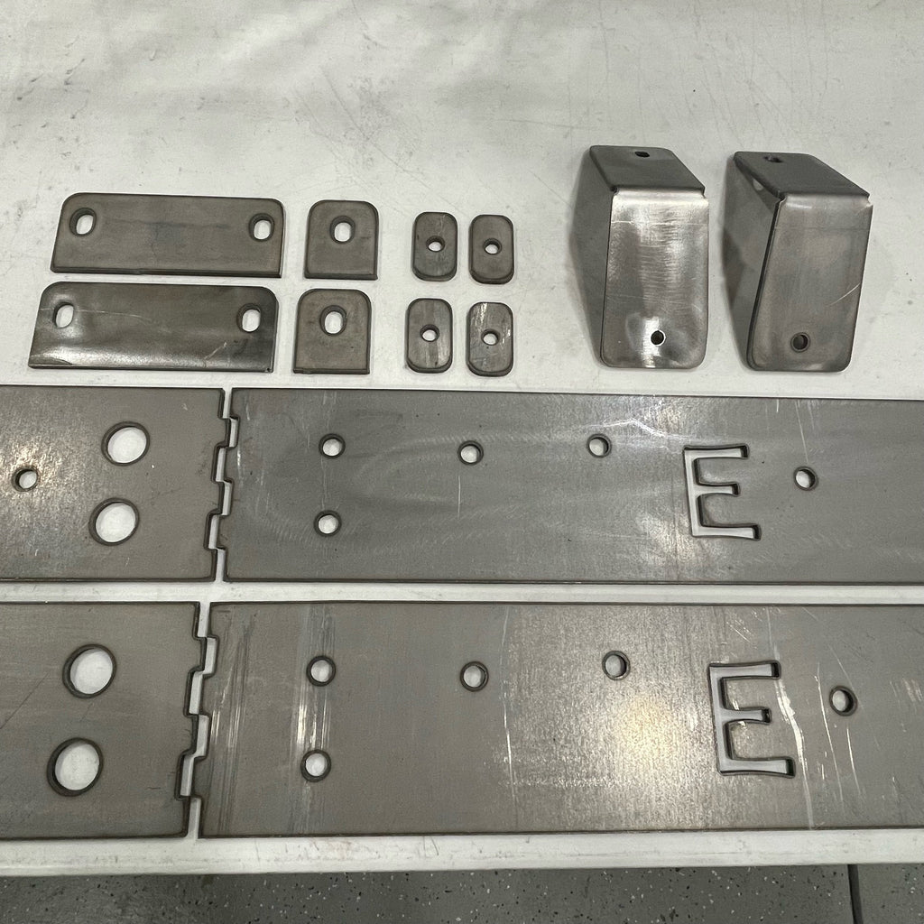Toyota Tacoma longbed 16-23 bolt-on rock sliders frame plate kit by Elevate Metalcraft, showing the durable metal frame plates.