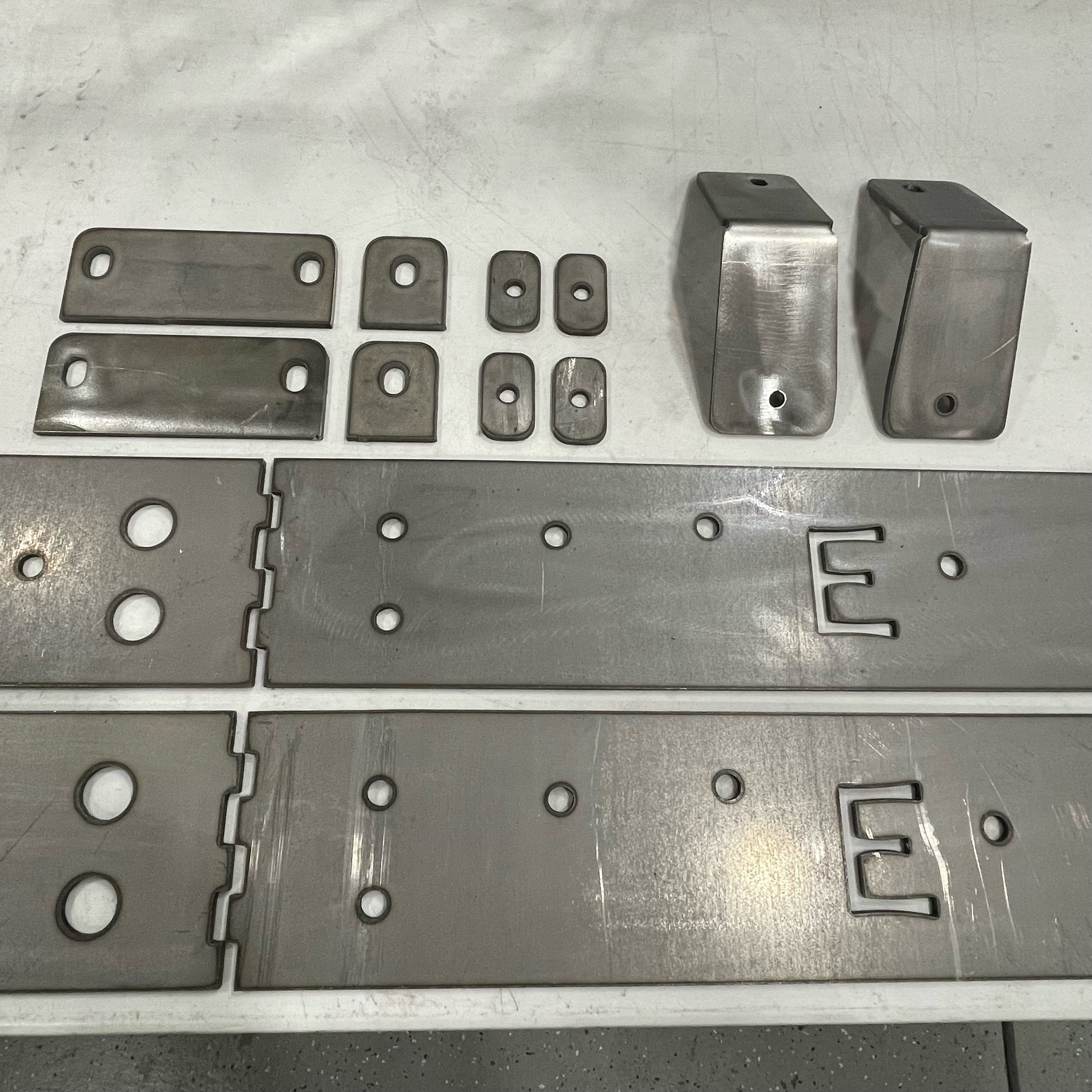 Toyota Tacoma longbed 16-23 bolt-on rock sliders frame plate kit by Elevate Metalcraft, showing the durable metal frame plates.
