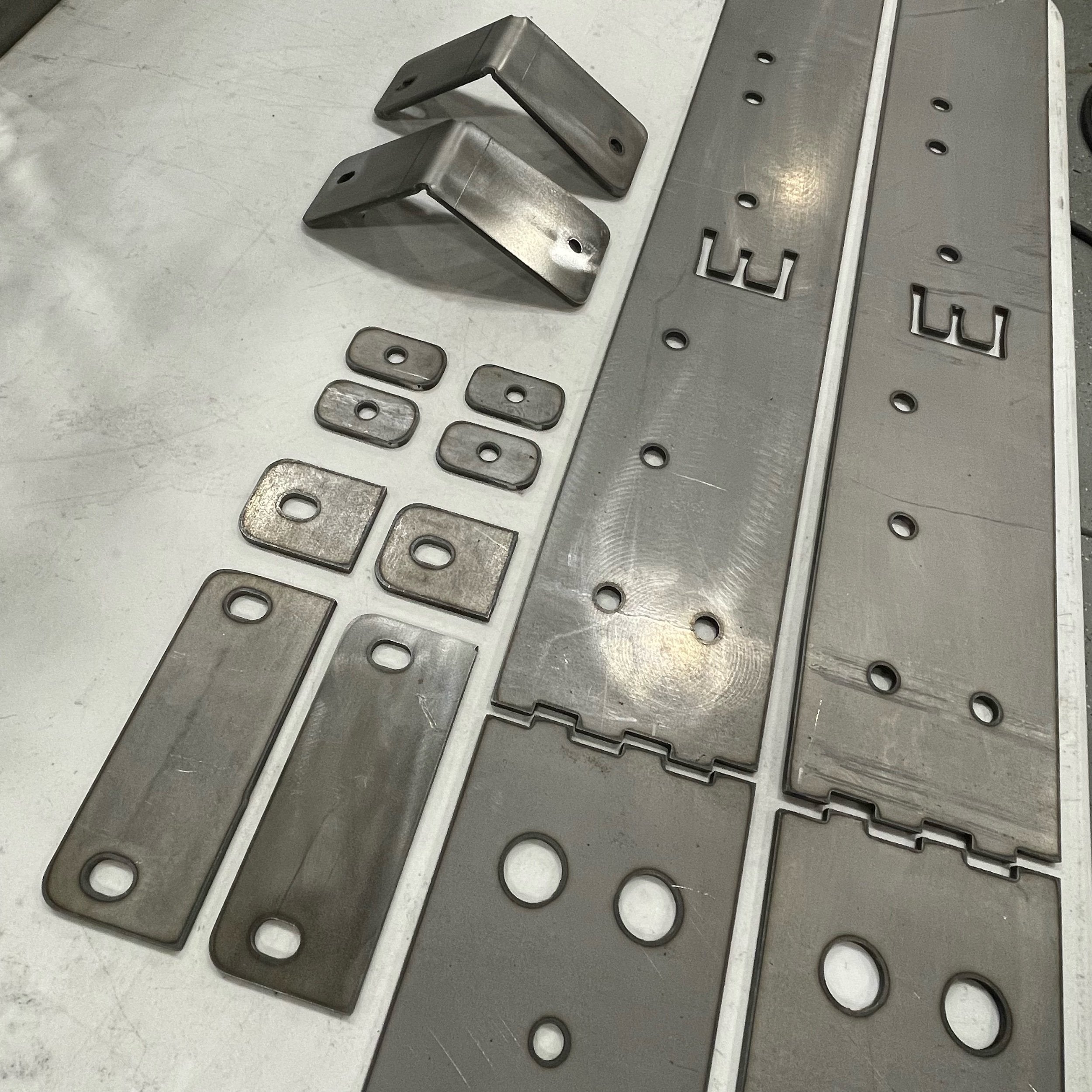 Elevate Metalcraft rock sliders frame plate kit installed on a Toyota Tacoma longbed (2016-2023) for added protection and durability.