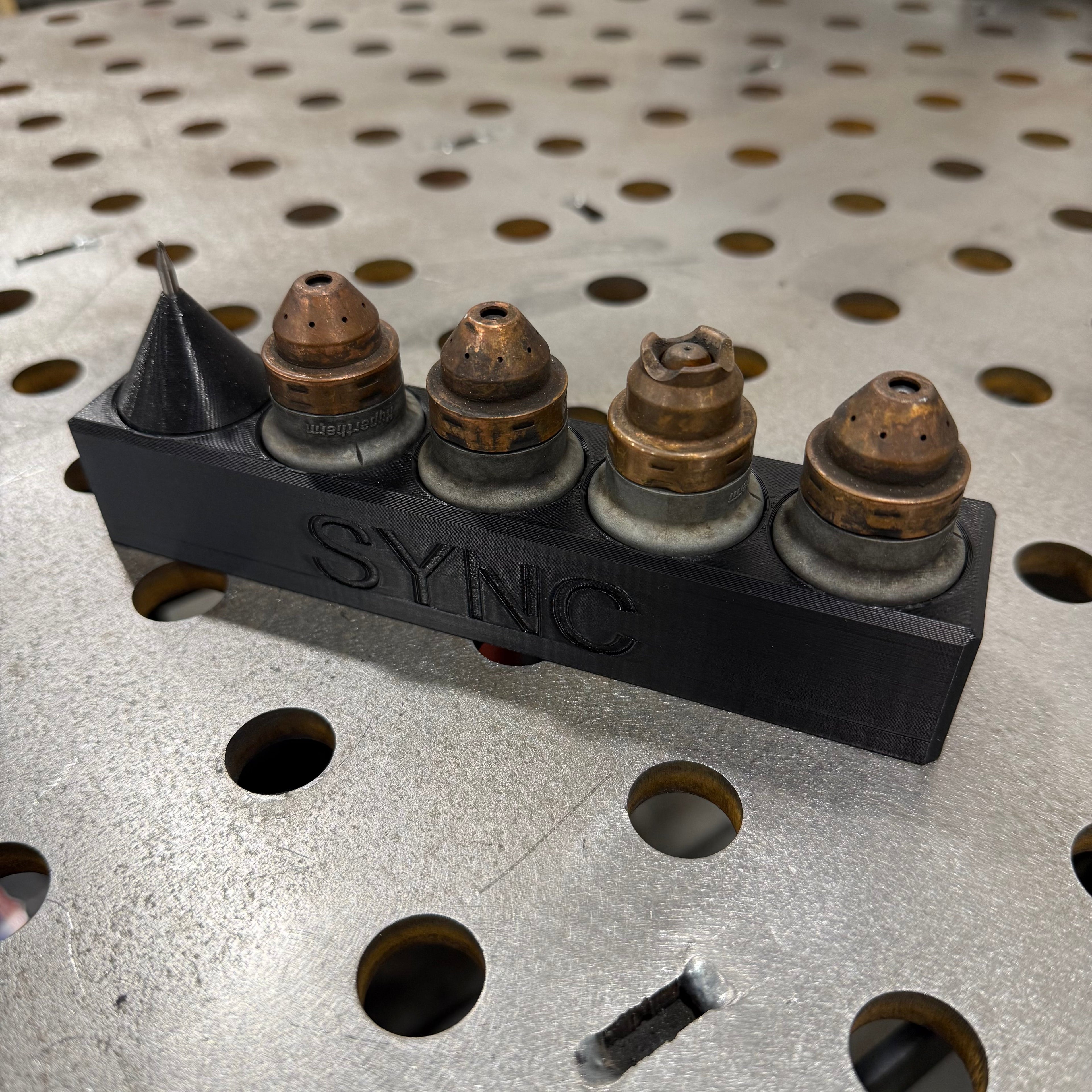 Elevate Metalcraft Hypertherm Sync Plasma Cartridge Organizer magnetic CNC tool holder with multiple slots for plasma cartridges.