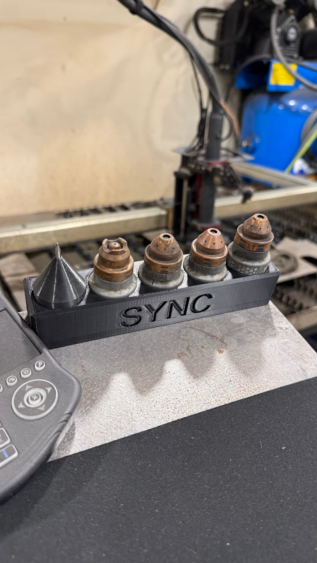 Elevate Metalcraft Sync Plasma Cartridge Organizer with magnetic CNC design, holding Hypertherm Sync plasma cartridges securely.
