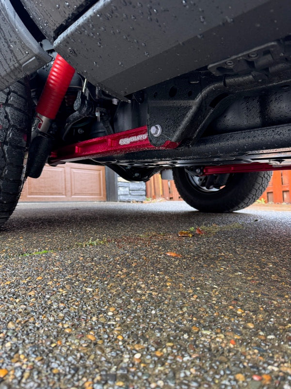 FR SPORT Camburg Toyota Tundra KINETIK Series rear billet trailing arm kit in red for 2022-2023 2WD and 4WD trucks.