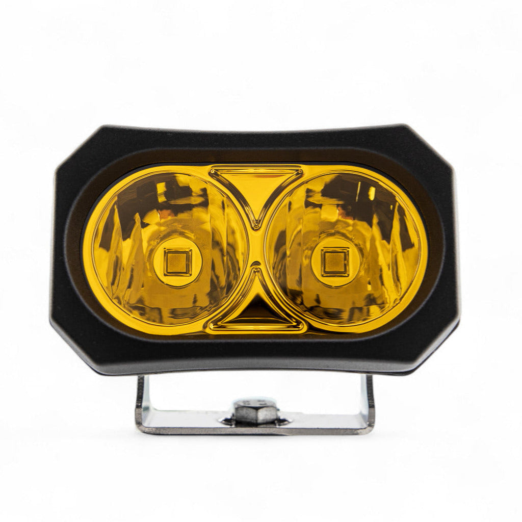Pair of GGLighting GP20 LED Pods in amber color, showcasing durable outdoor lighting with rugged design.