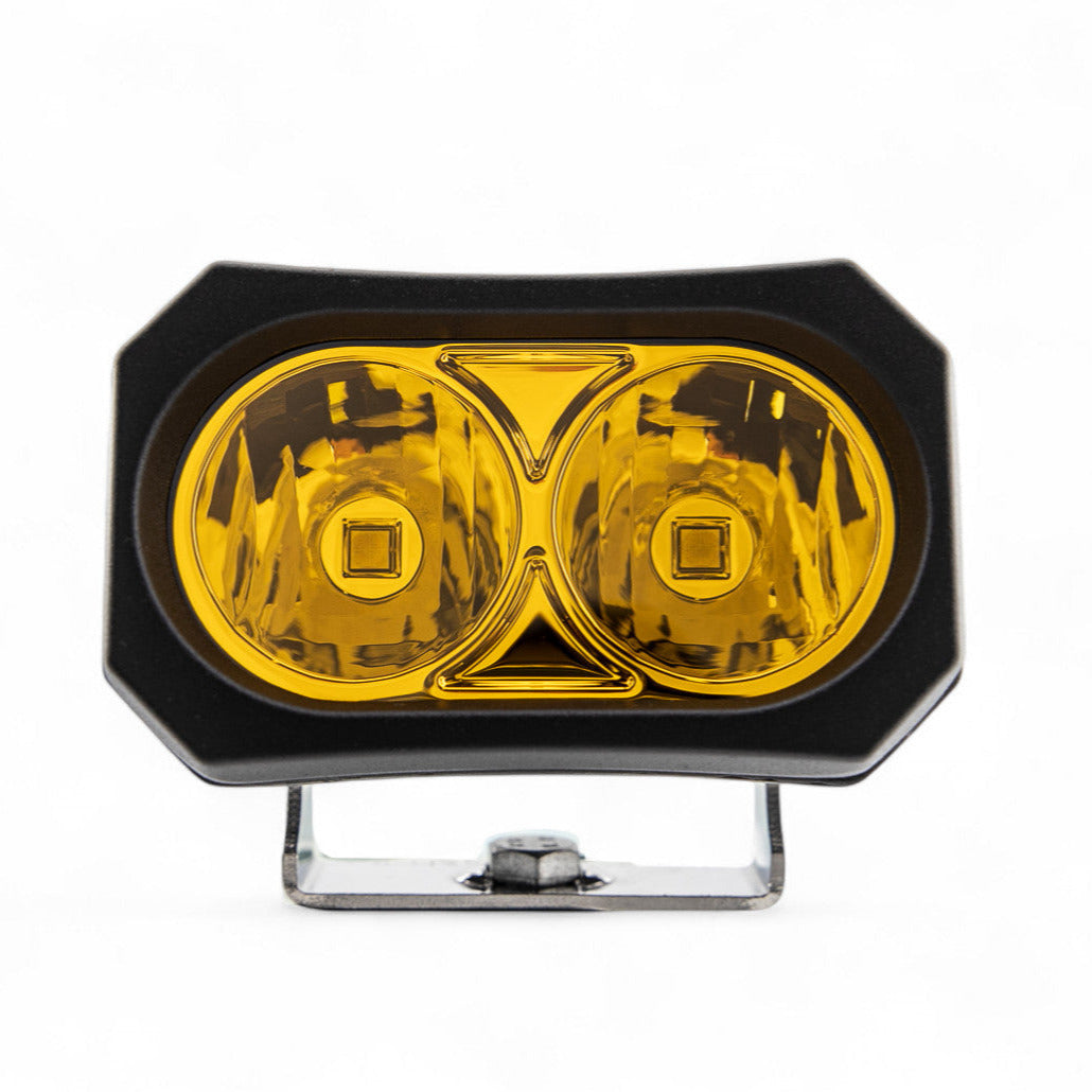 Pair of GGLighting GP20 LED Pods in amber color, showcasing durable outdoor lighting with rugged design.