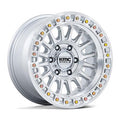 KMC KM552 IMS Gloss Silver with Machined Face simulated beadlock wheels on a vehicle, showcasing detailed wheel design and finish.