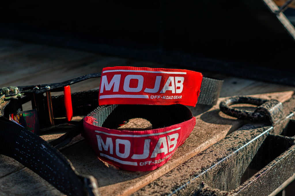 MOJAB OFFROAD 2" x 10' ratchet tie-down with closed hook and 2" x 39" axle tie-down set of 4 for secure vehicle transport.