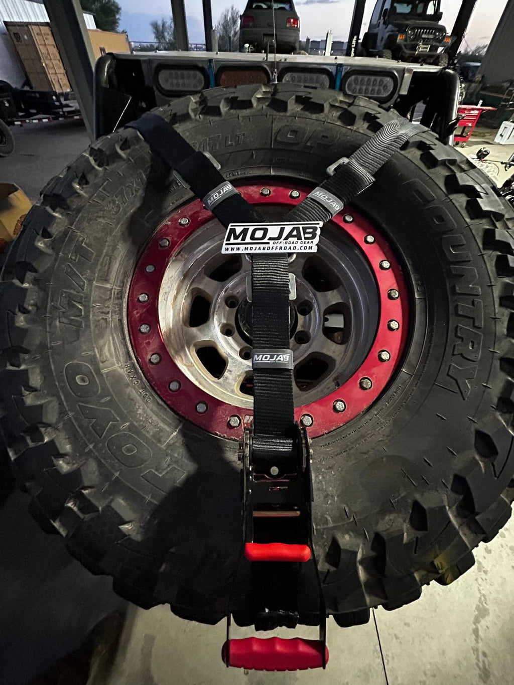 MOJAB OFFROAD 2" x 10' ratchet tie-down with closed hook and 2" x 39" axle tie-down set of four for secure vehicle transport.