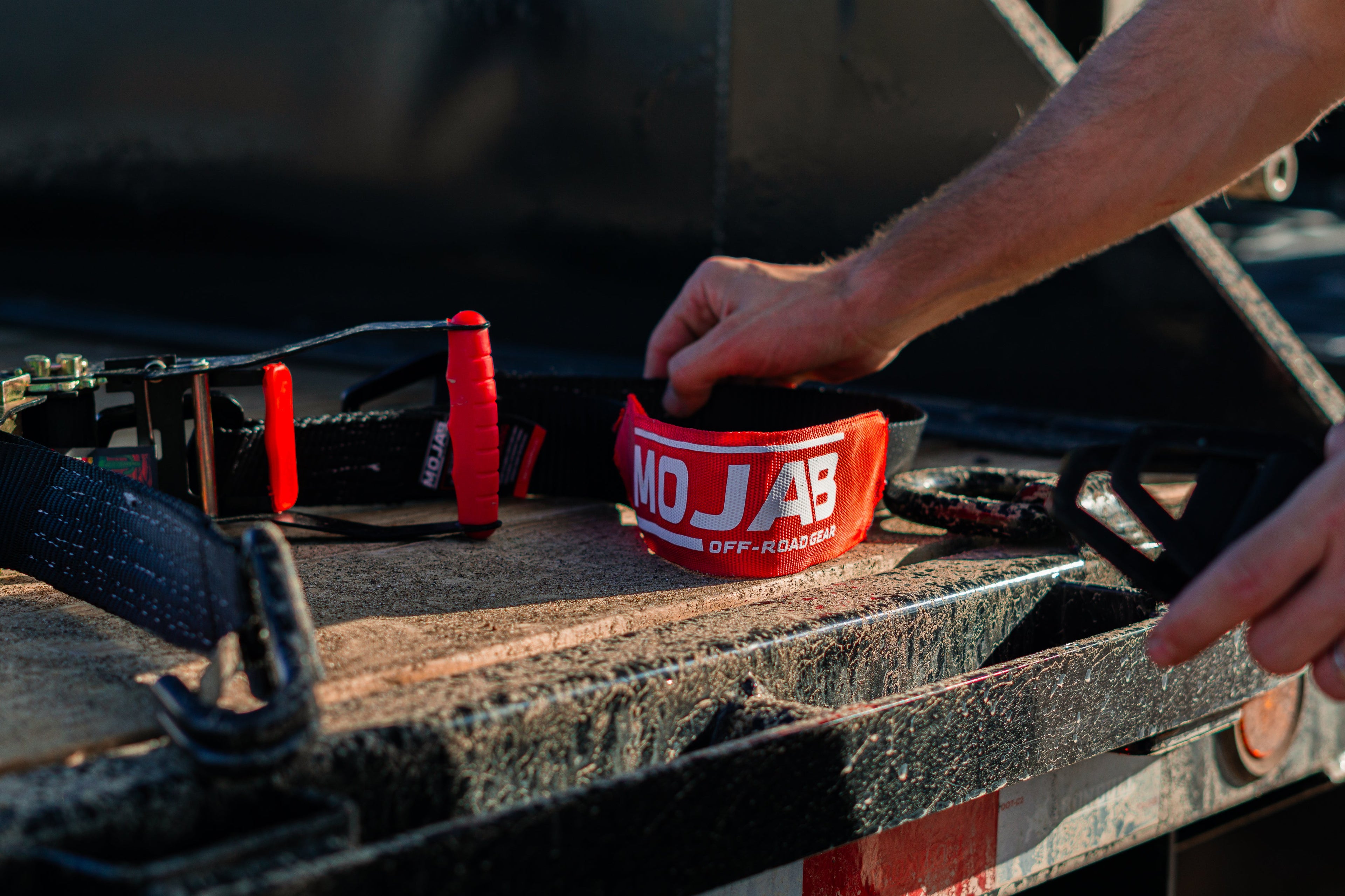 MOJAB OFFROAD 2" x 10' ratchet tie-down with closed hook and 2" x 39" axle tie-down set of four for secure vehicle transport.