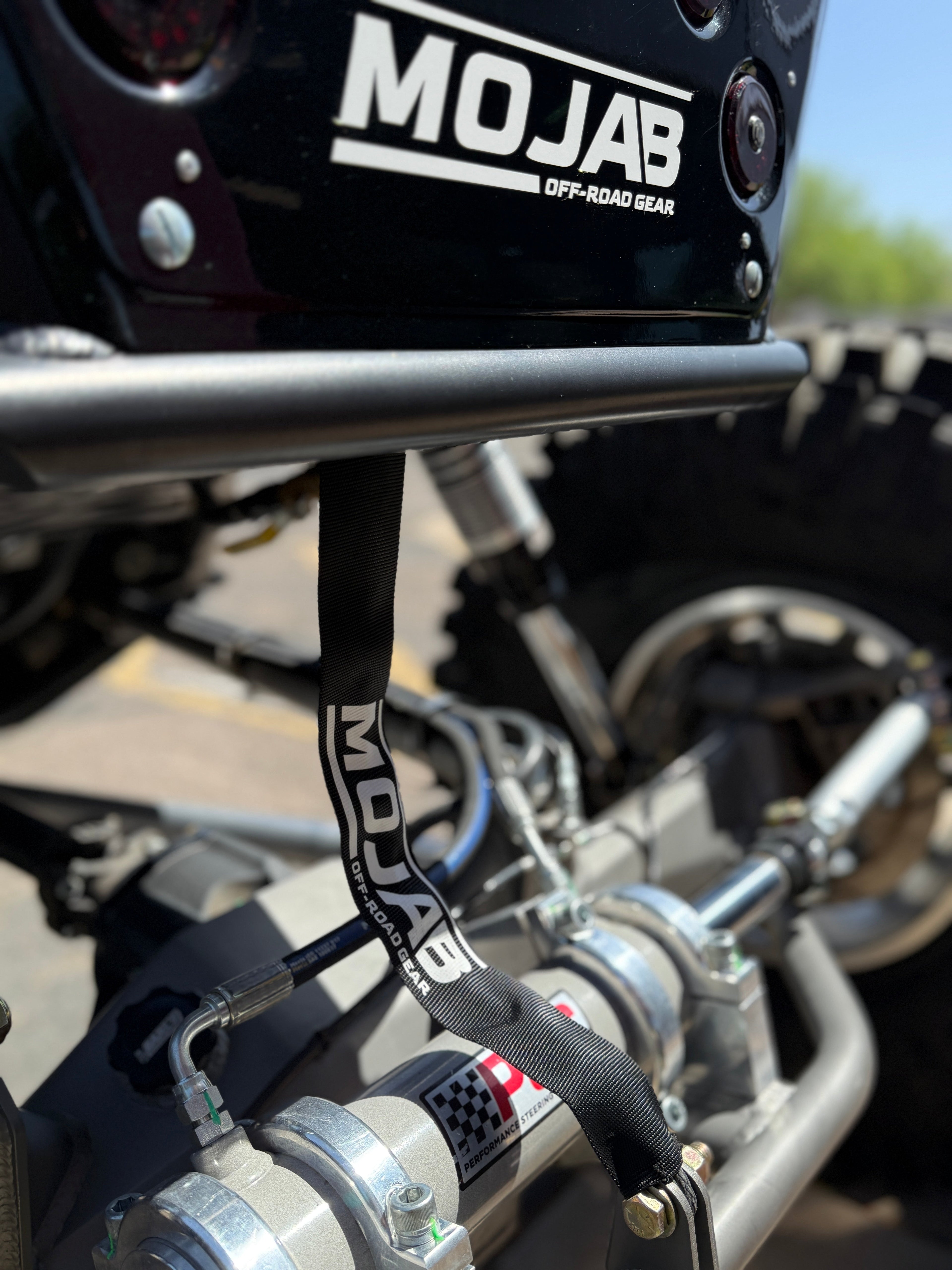 MOJAB OFFROAD MO6.0 Series Electric Winch with sturdy metal frame and cable drum for vehicle recovery and off-road use.