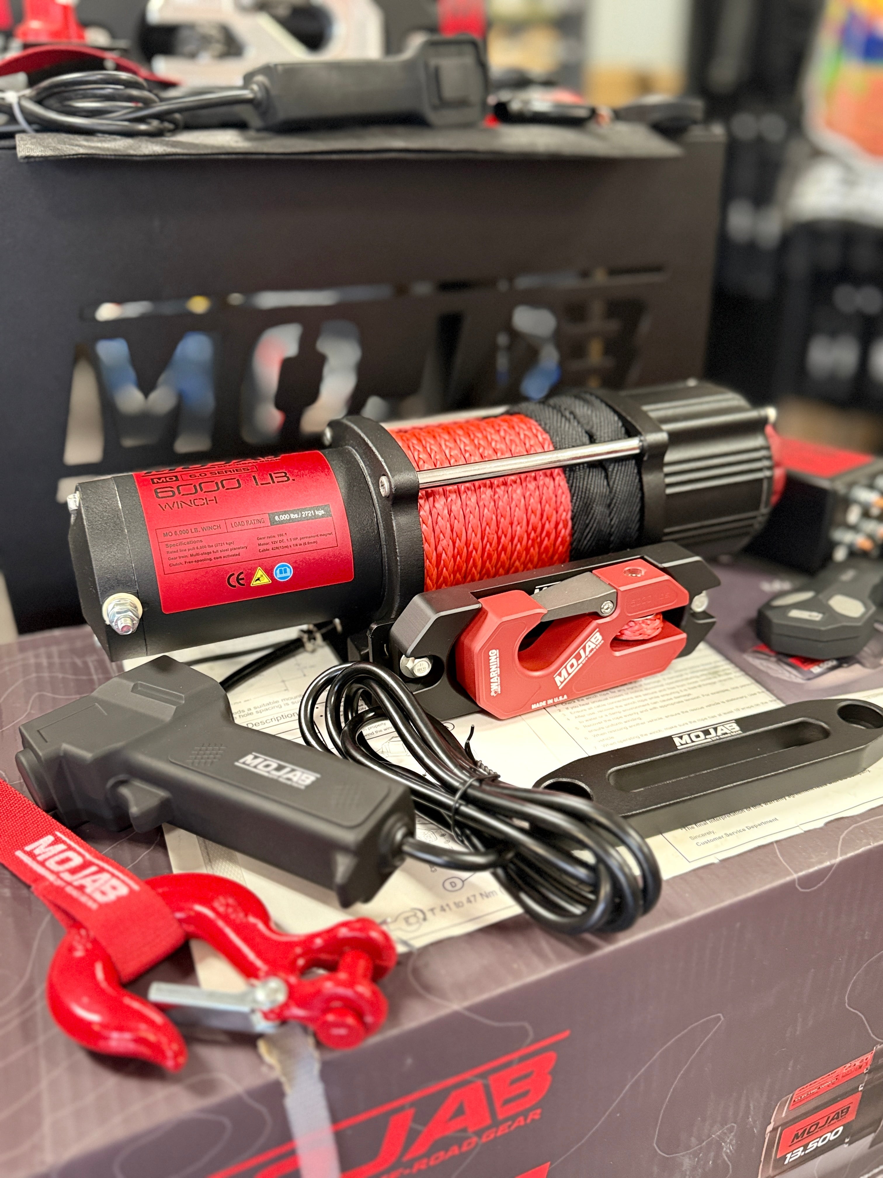 MOJAB OFFROAD MO6.0 Series Electric Winch on a vehicle, showcasing its robust design and durable construction for off-road use.