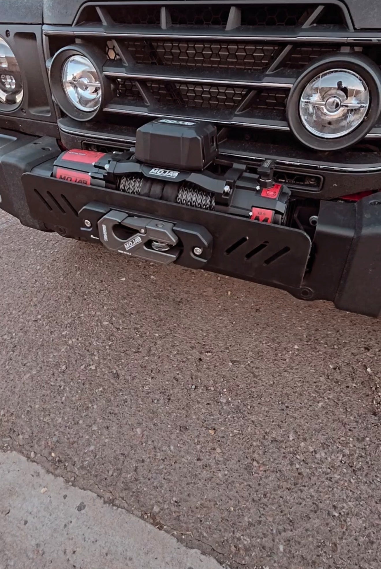MOJAB OFFROAD MO13.5 Series electric winch with black metal frame and wired remote for vehicle recovery and off-road use