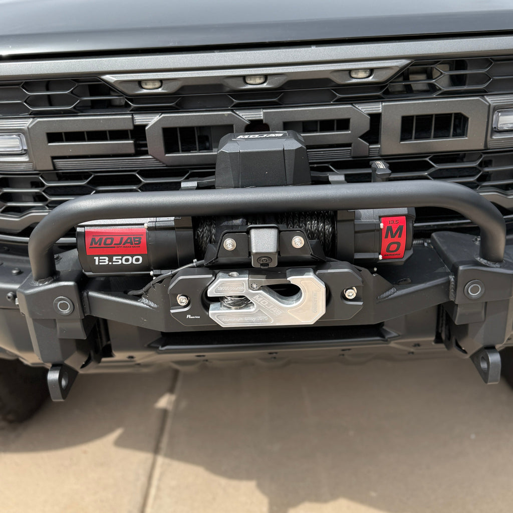 MOJAB OFFROAD MO13.5 Series electric winch with steel cable and steel mounting plate for off-road vehicle recovery.