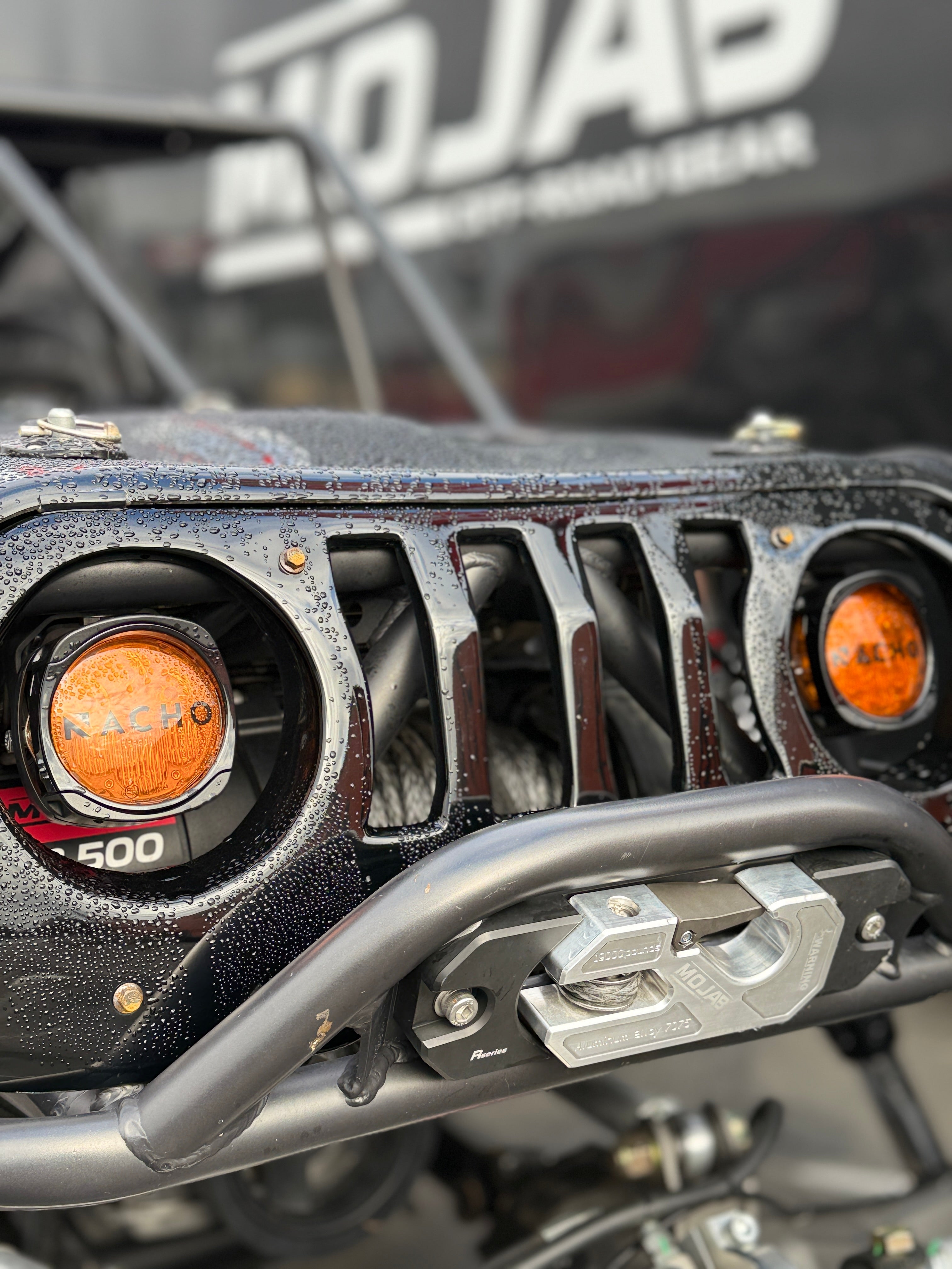 MOJAB OFFROAD MO13.5 Series electric winch with steel cable and rugged metal casing, designed for off-road vehicle recovery.