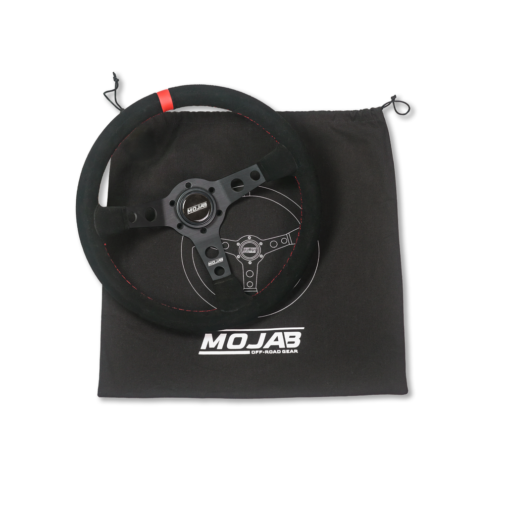 13.5-inch MOJAB OFFROAD deep dish steering wheel in black leather or suede with ergonomic design.