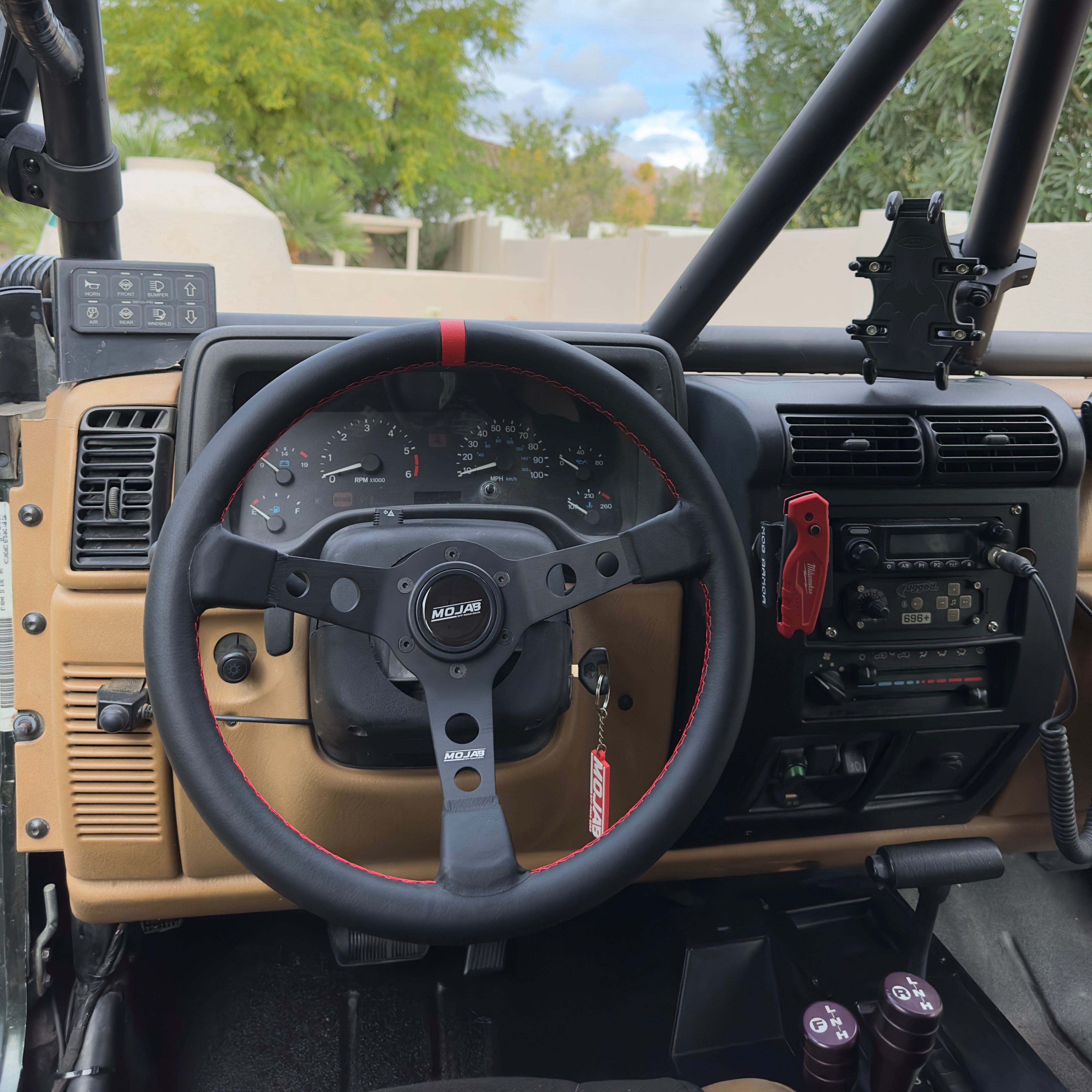13.5-inch MOJAB OFFROAD deep dish steering wheel with leather or suede cover, showcasing the luxurious textured surface.