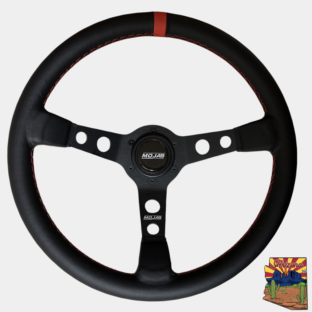 13.5-inch MOJAB OFFROAD deep dish steering wheel with leather or suede grip, featuring a sleek, sporty design.