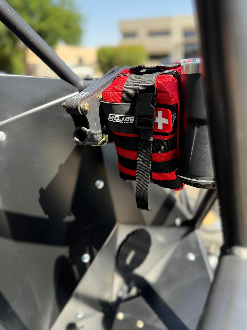 Red MOJAB OFFROAD 151-piece recovery first aid kit with bandages, antiseptic wipes, and emergency supplies for outdoor safety.