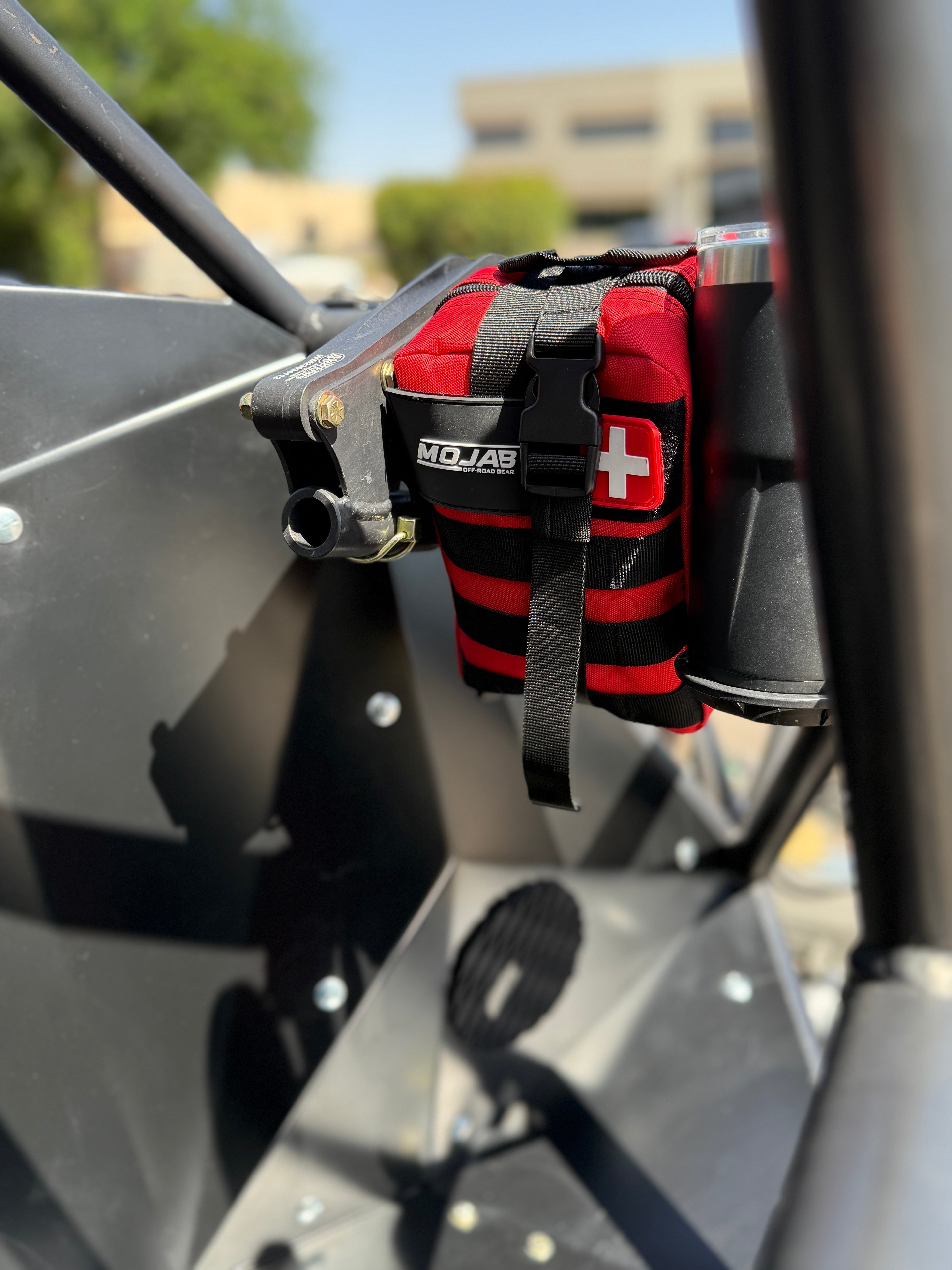 Red MOJAB OFFROAD 151-piece recovery first aid kit with bandages, antiseptic wipes, and emergency supplies for outdoor safety.