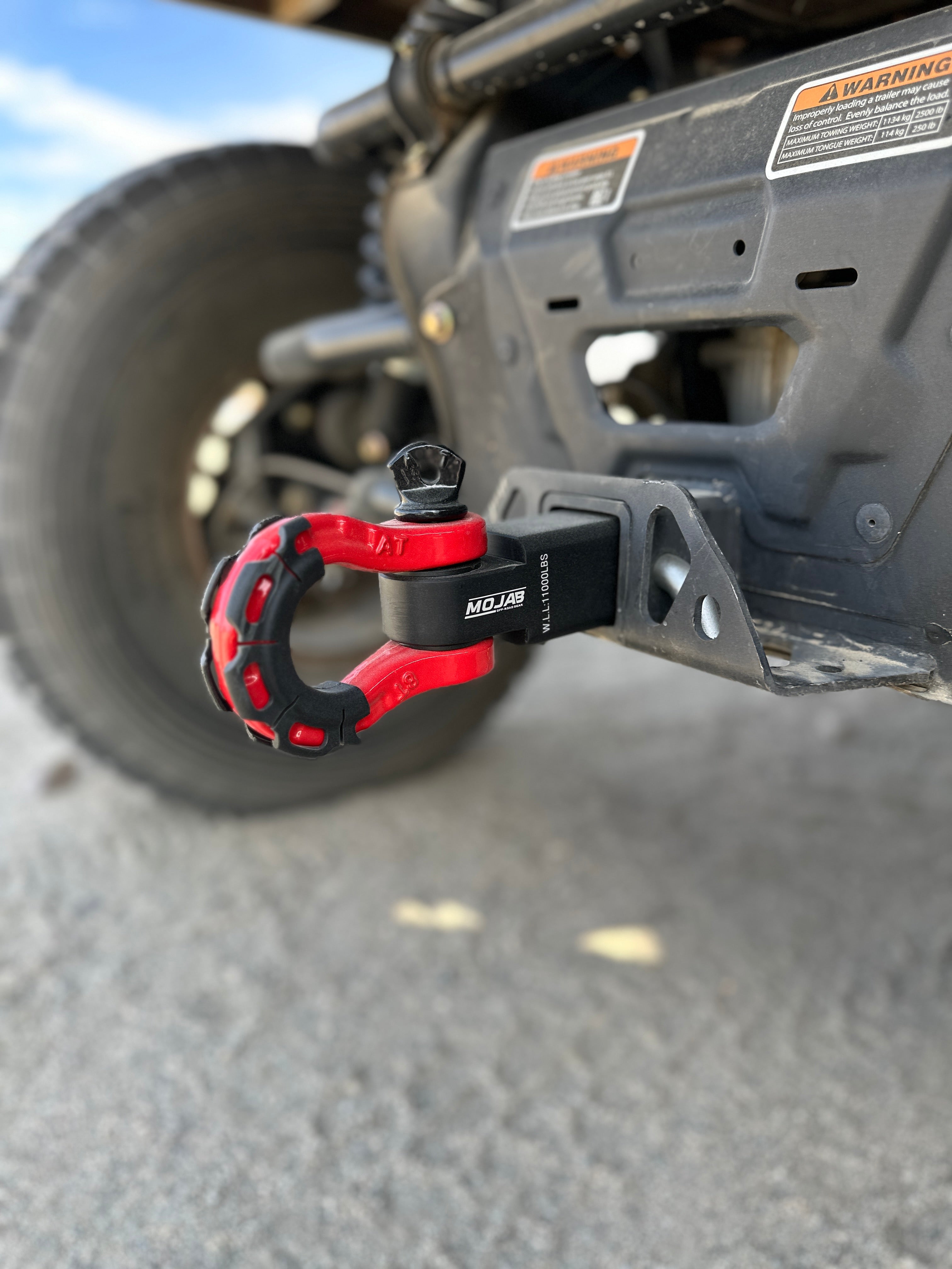 Red 2-inch aluminum hitch receiver with steel D-shackle from MOJAB OFFROAD, designed for off-road towing and recovery.
