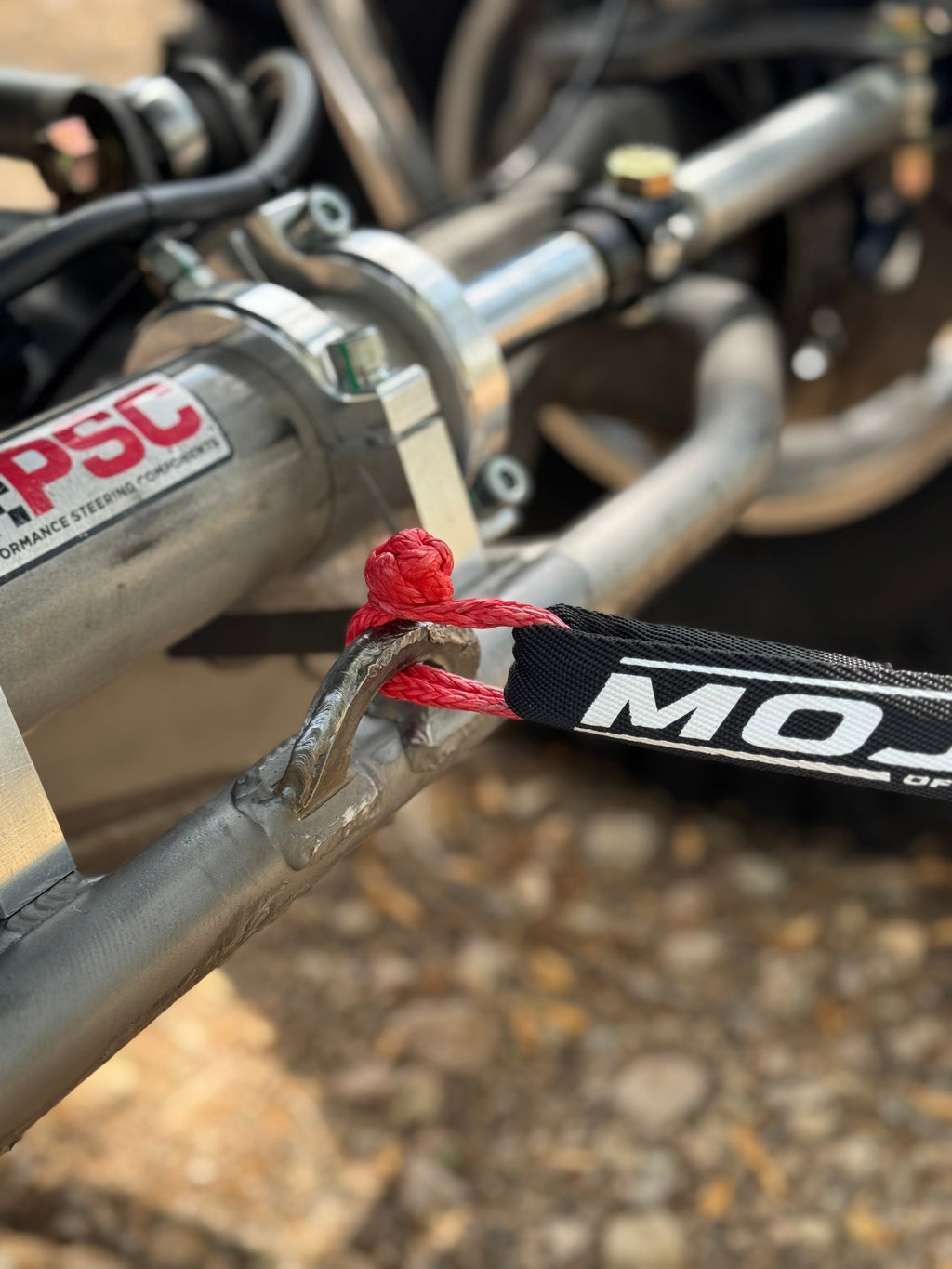 Red MOJAB OFFROAD Micro Soft Shackle 3/16" x 6" keychain and recovery tool with lifetime warranty, made of durable metal.