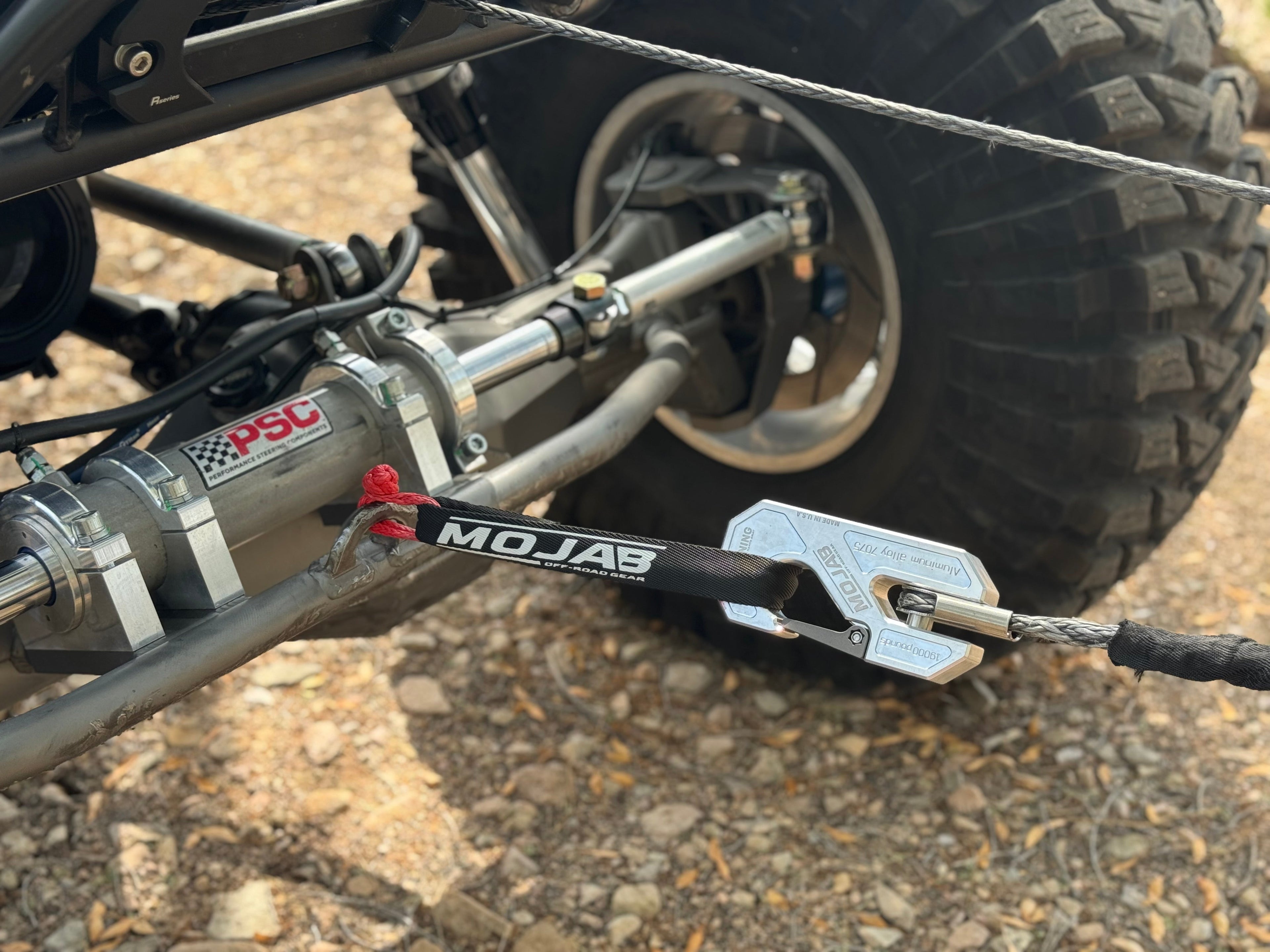 Red Mojab Offroad Micro Soft Shackle 3/16'' x 6'' used as a keychain, durable recovery gear with lifetime warranty