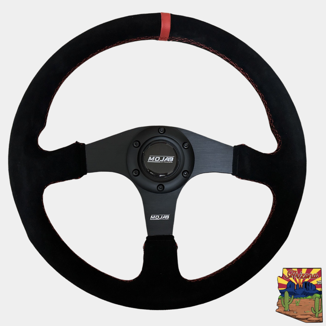 13.5-inch MOJAB OFFROAD flat steering wheel in premium leather or suede with ergonomic design.