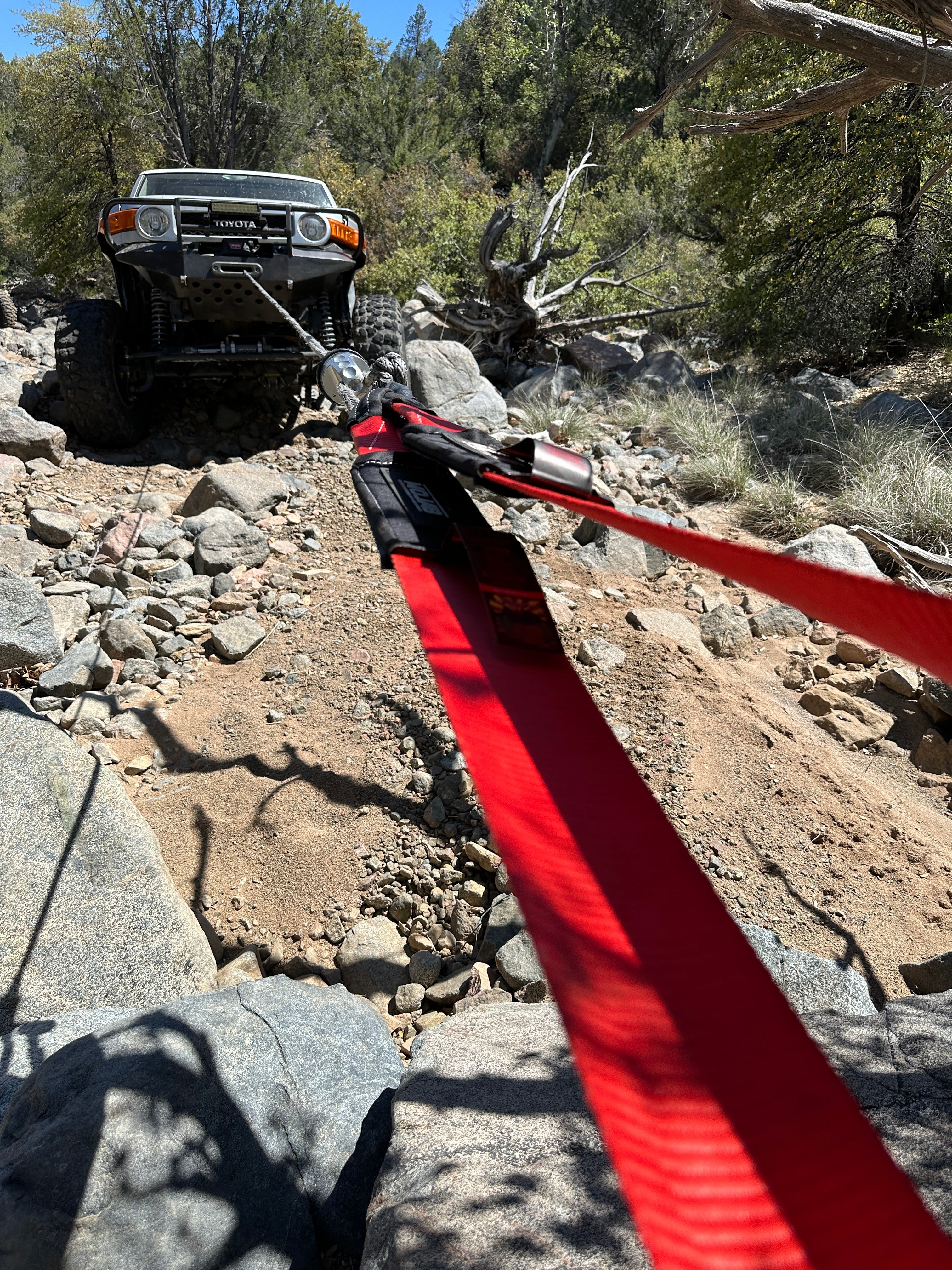 MOJAB OFFROAD 4x10' Tree Saver Tow Strap with heavy-duty design, reinforced stitching, and lifetime warranty for vehicle recovery.
