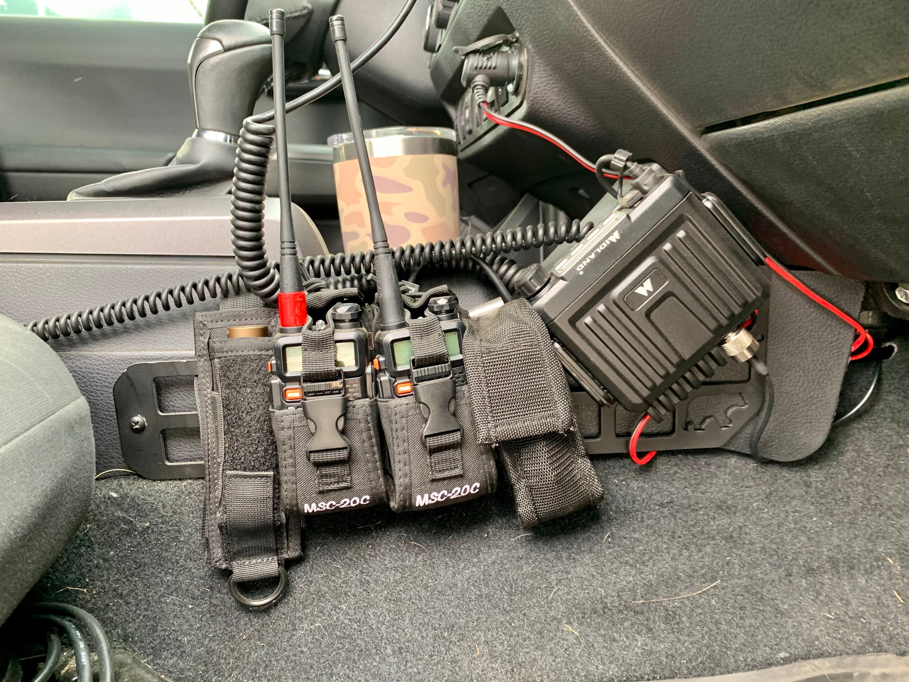 2nd/3rd Gen Toyota Tacoma center console Molle panel set by New Holland Overland, designed for organized storage and gear attachment.