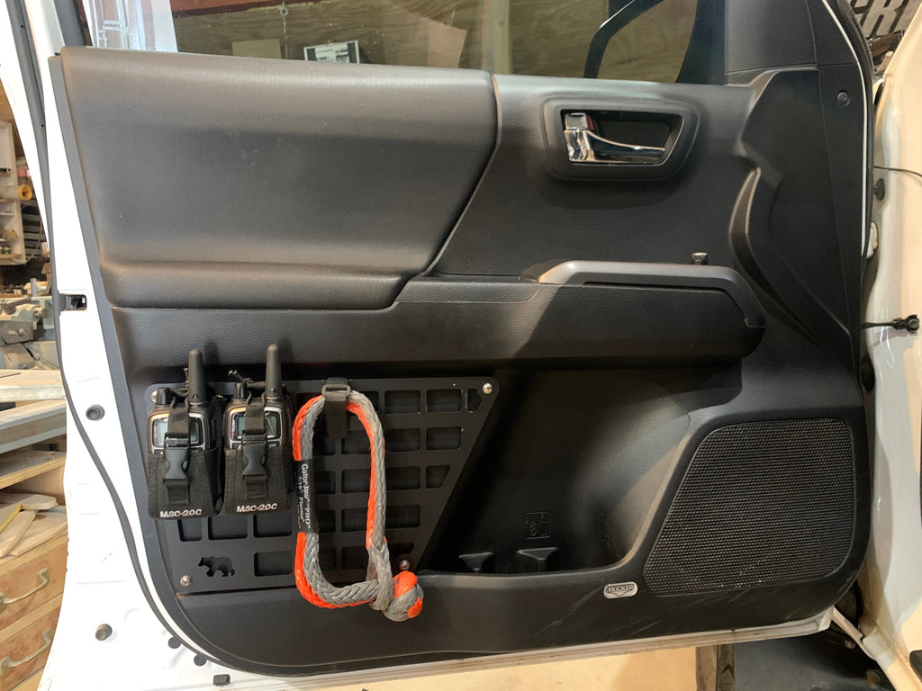 3rd Gen Tacoma door Molle panel set by New Holland Overland installed on vehicle door with mounting hardware.