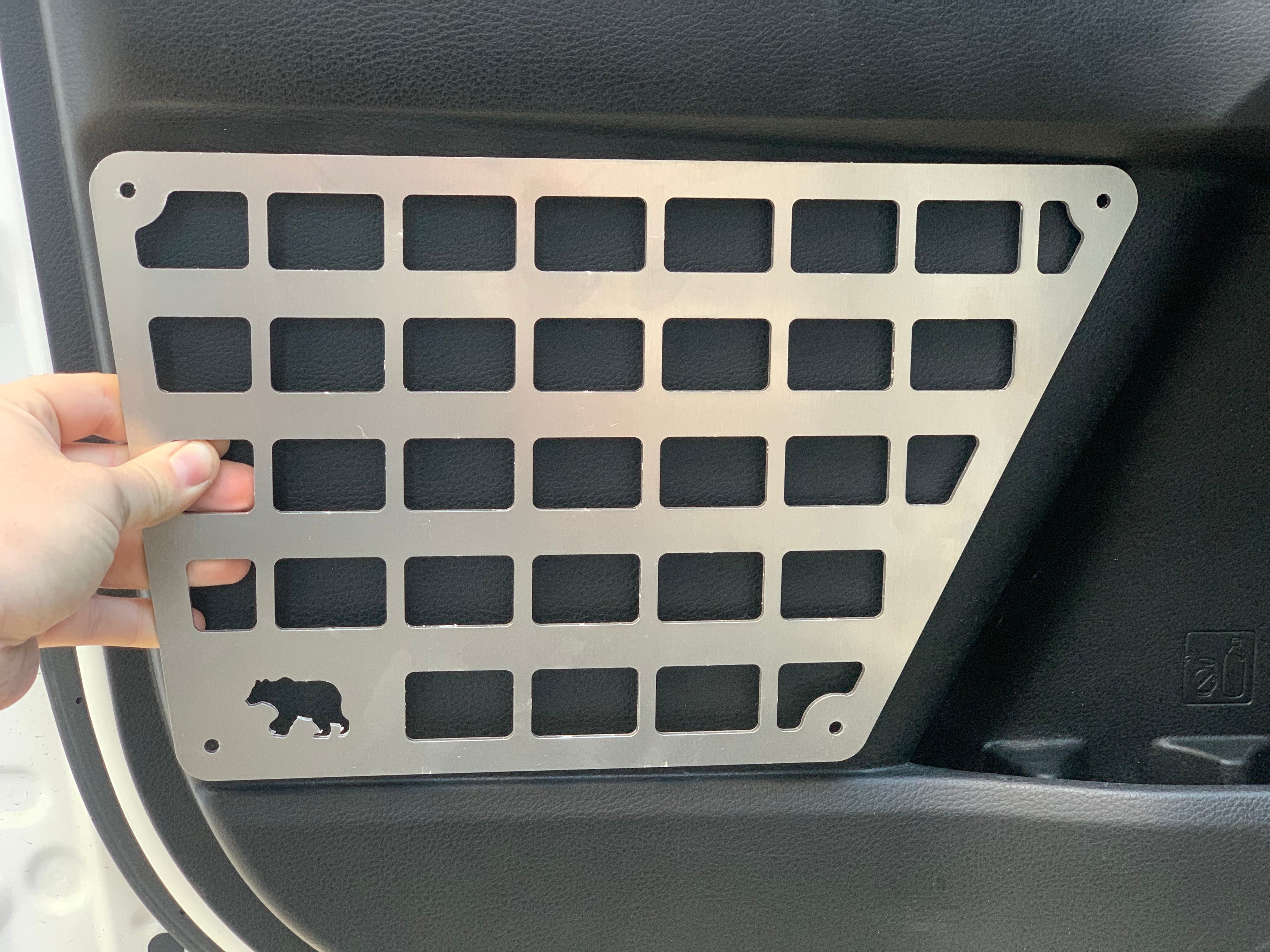 3rd Gen Tacoma door Molle panel set by New Holland Overland, rugged storage and tactical gear mounting solution.