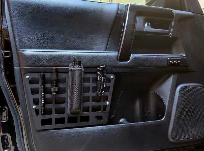 5th Gen 4Runner door Molle panel set by New Holland Overland, black metal panels with attachment points for gear storage.