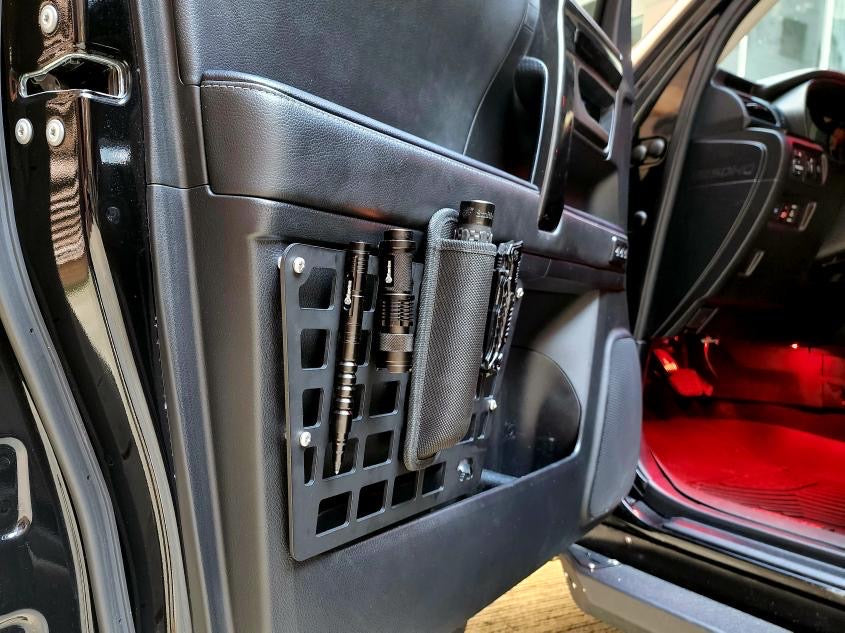 5th Gen Toyota 4Runner door Molle panel set by New Holland Overland, rugged black accessory for vehicle customization.