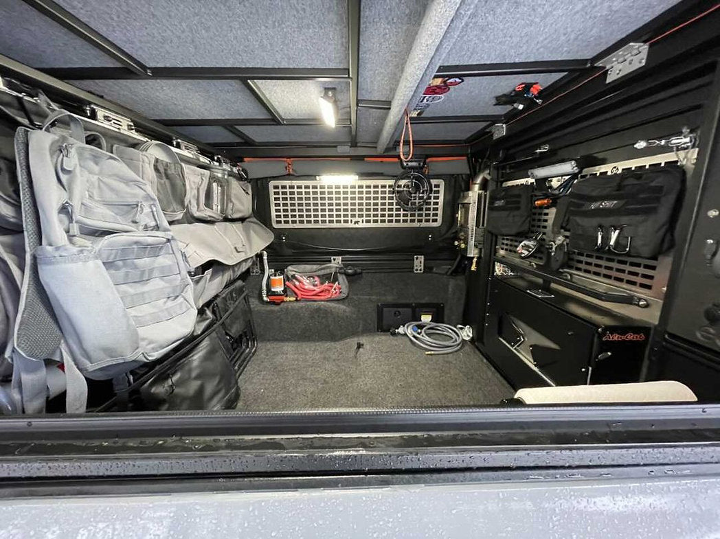 Alu-Cab Side Door Molle Panel installed on a vehicle door, designed for New Holland Overland off-road and outdoor equipment.