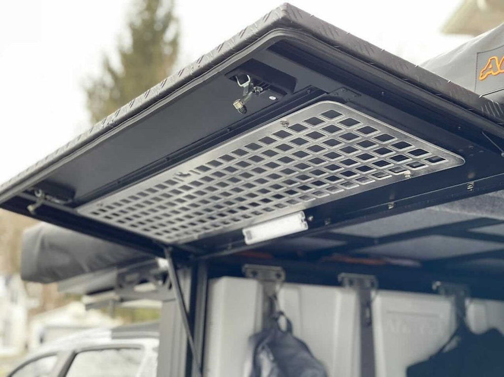 Alu-Cab Side Door Molle Panel installed on a vehicle door, designed for mounting accessories, by New Holland Overland.