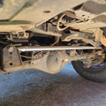 Overland Custom Design Panhard Bar for 96+ Toyota 4Runner, FJ Cruiser, and GX, shown installed on vehicle suspension.