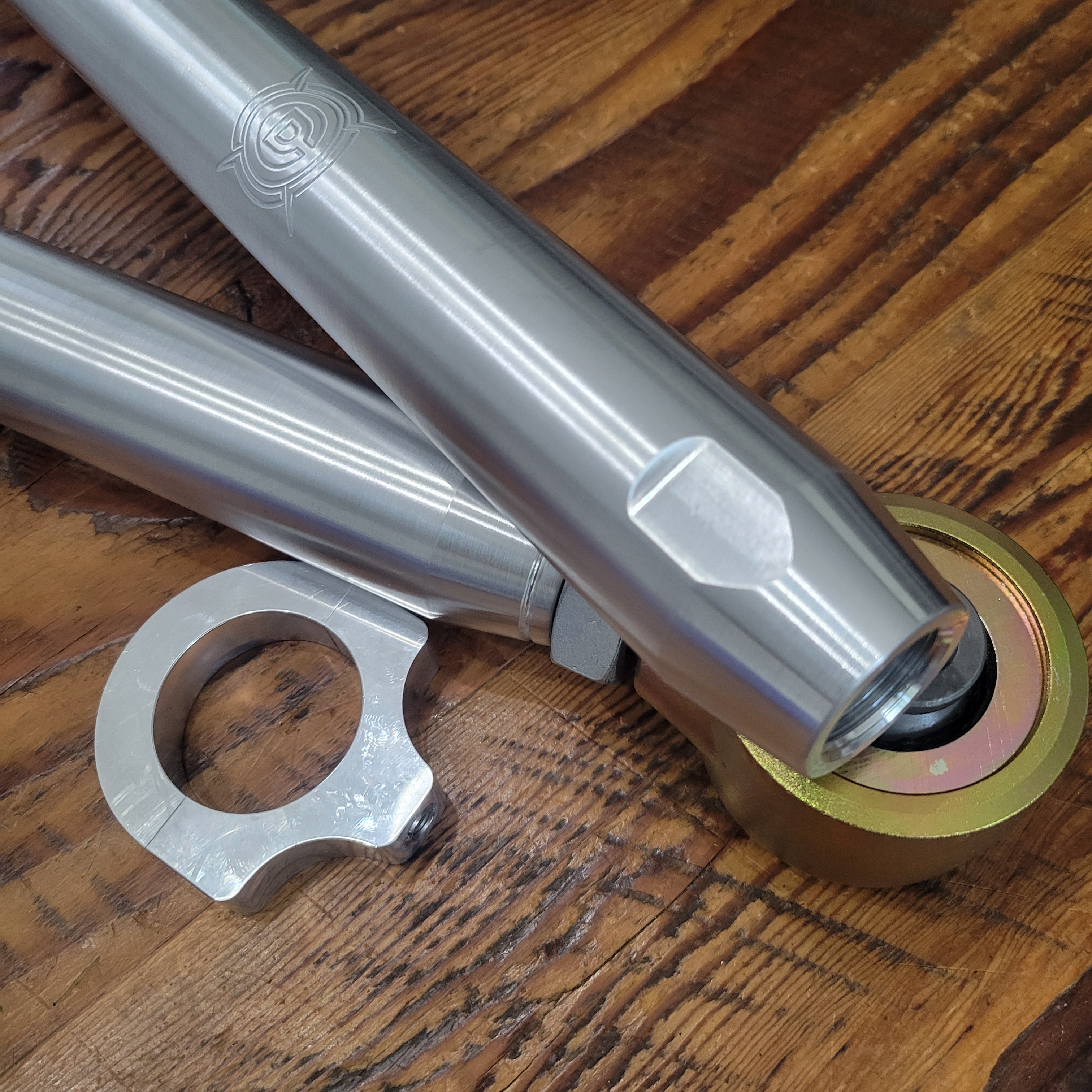 Overland Custom Design lower control arms for 4th/5th Gen 4Runner, FJ Cruiser, and GX vehicles, shown installed on a vehicle.