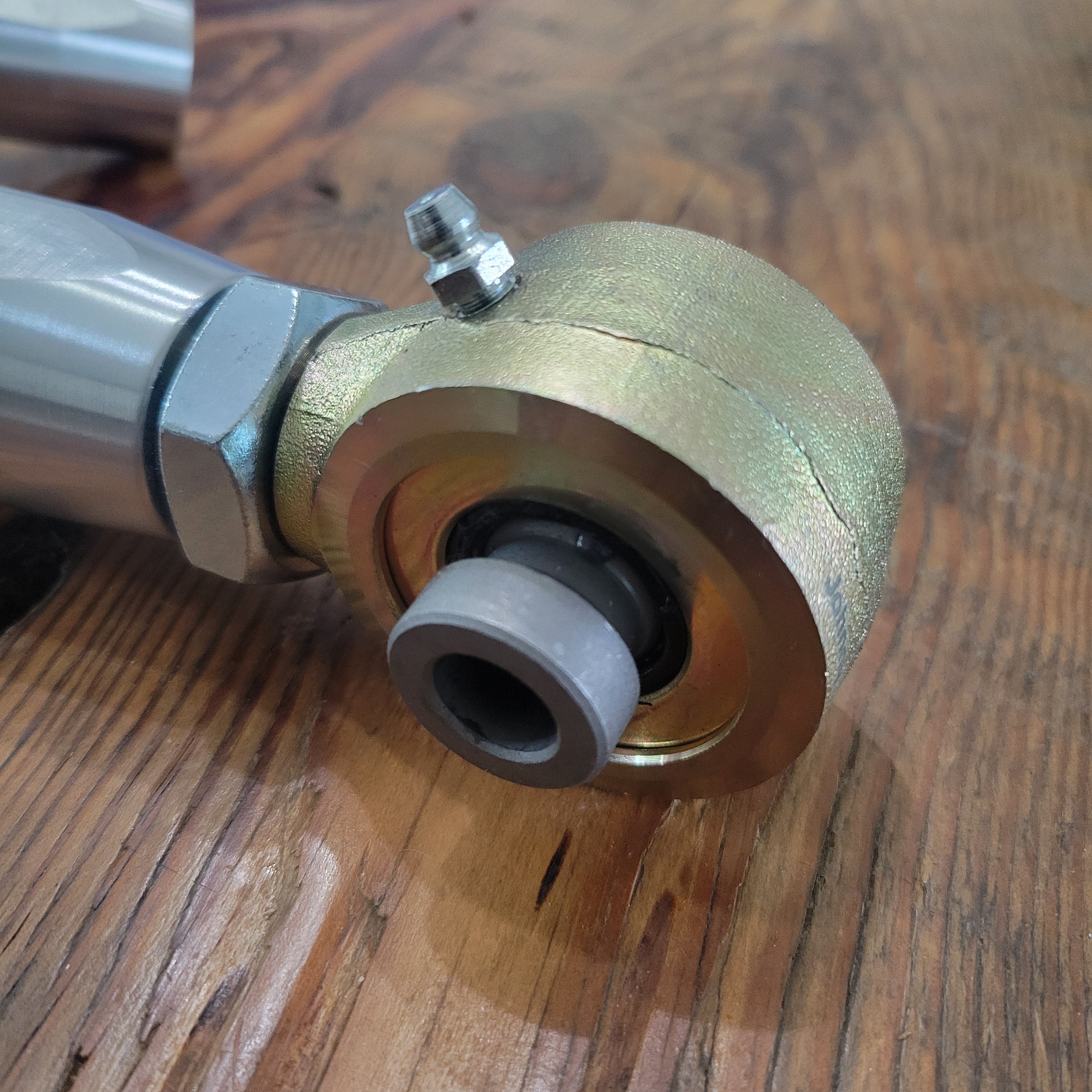 Overland Custom Design upper control arms for 4Runner, FJ Cruiser, and GX vehicle suspension, shown installed on a vehicle.