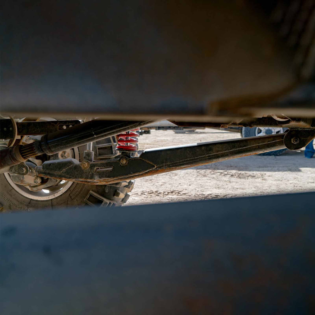 Pair of Riley Mountain Motorsports URC trailing arms, durable suspension components with detailed metal finish.