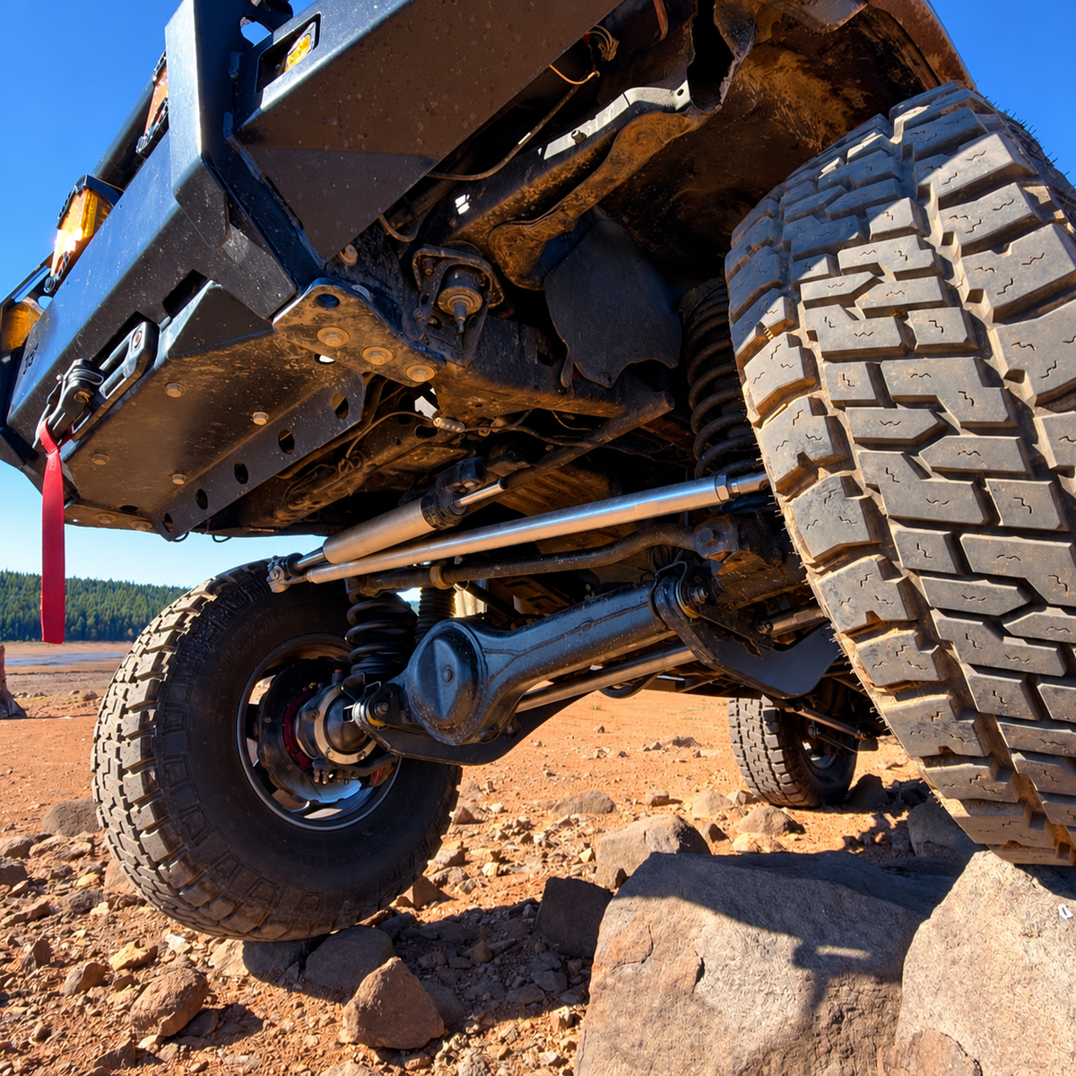 Overland Custom Design 80 Series steering linkage showing metal components and connection points for off-road vehicle steering system