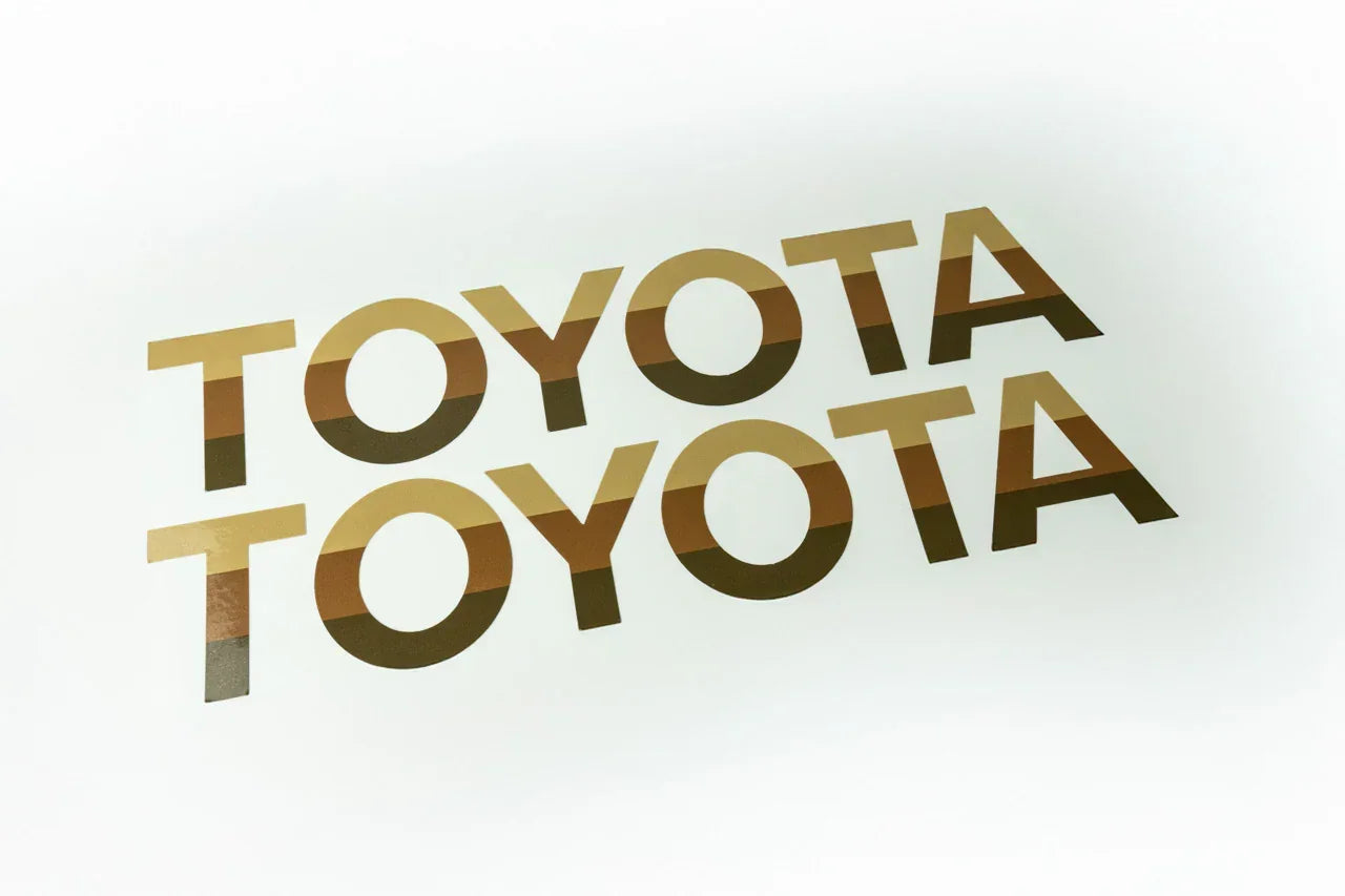 White Toyota emblem overlays for 2024+ Land Cruiser front grille by StickerFab, designed for easy installation and a sleek look.