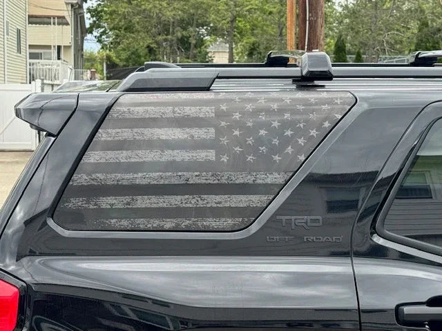Perforated American flag rear window overlay vinyl for 2025+ Toyota 4Runner exterior, in gray with patriotic design.