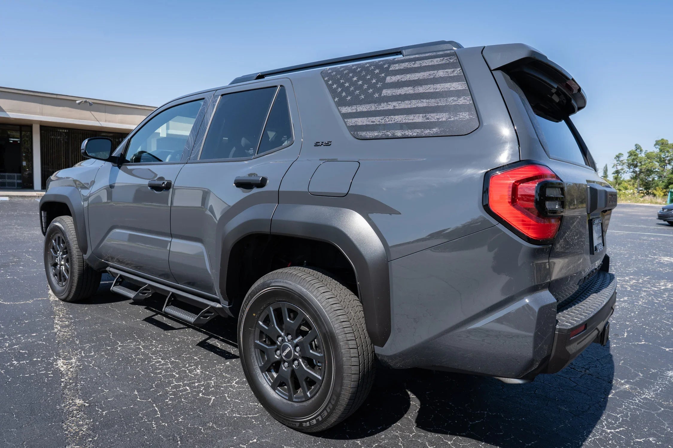 Perforated American flag rear window overlay vinyl for 2025+ Toyota 4Runner, exterior decal by StickerFab, gray carbonized design